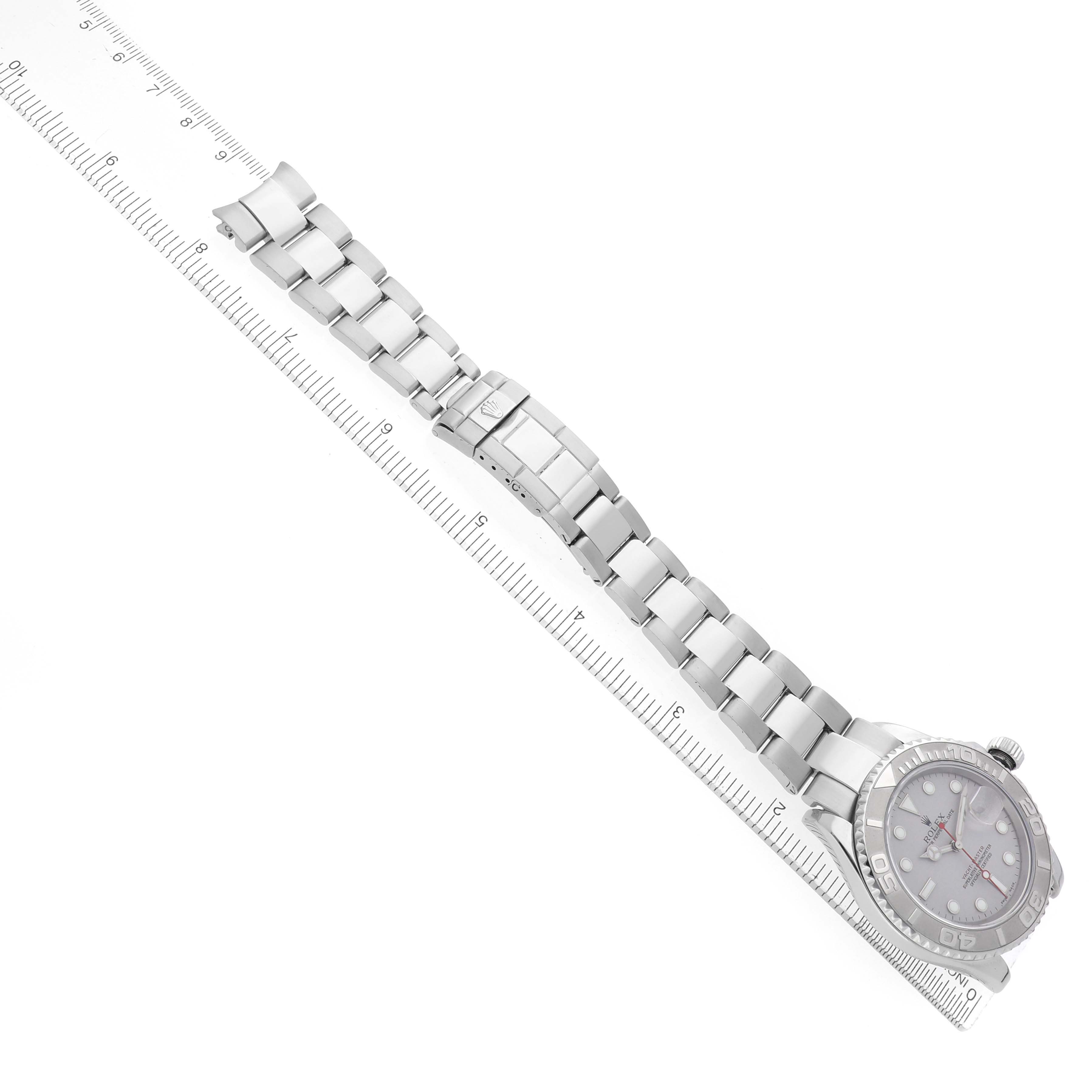 The Rolex Yacht-Master 16622 Men
s Stainless Steel Silver Dial watch is shown from a top-down angle, displaying the face, bezel, and full metal bracelet with a clasp.