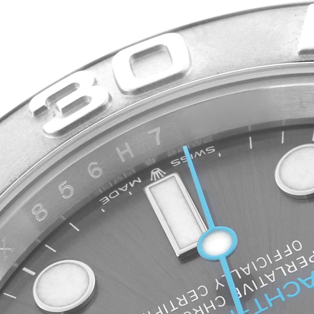 The image shows a close-up of the Rolex Yacht-Master 126622 Men
s Stainless Steel Grey Dial
s bezel, part of the dial, and the minute hand.