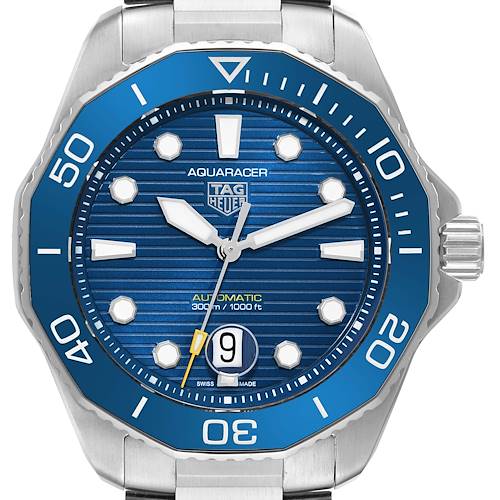 The image shows a front view of the Tag Heuer Aquaracer watch, highlighting the blue bezel, dial, and date window at 6 o'clock.