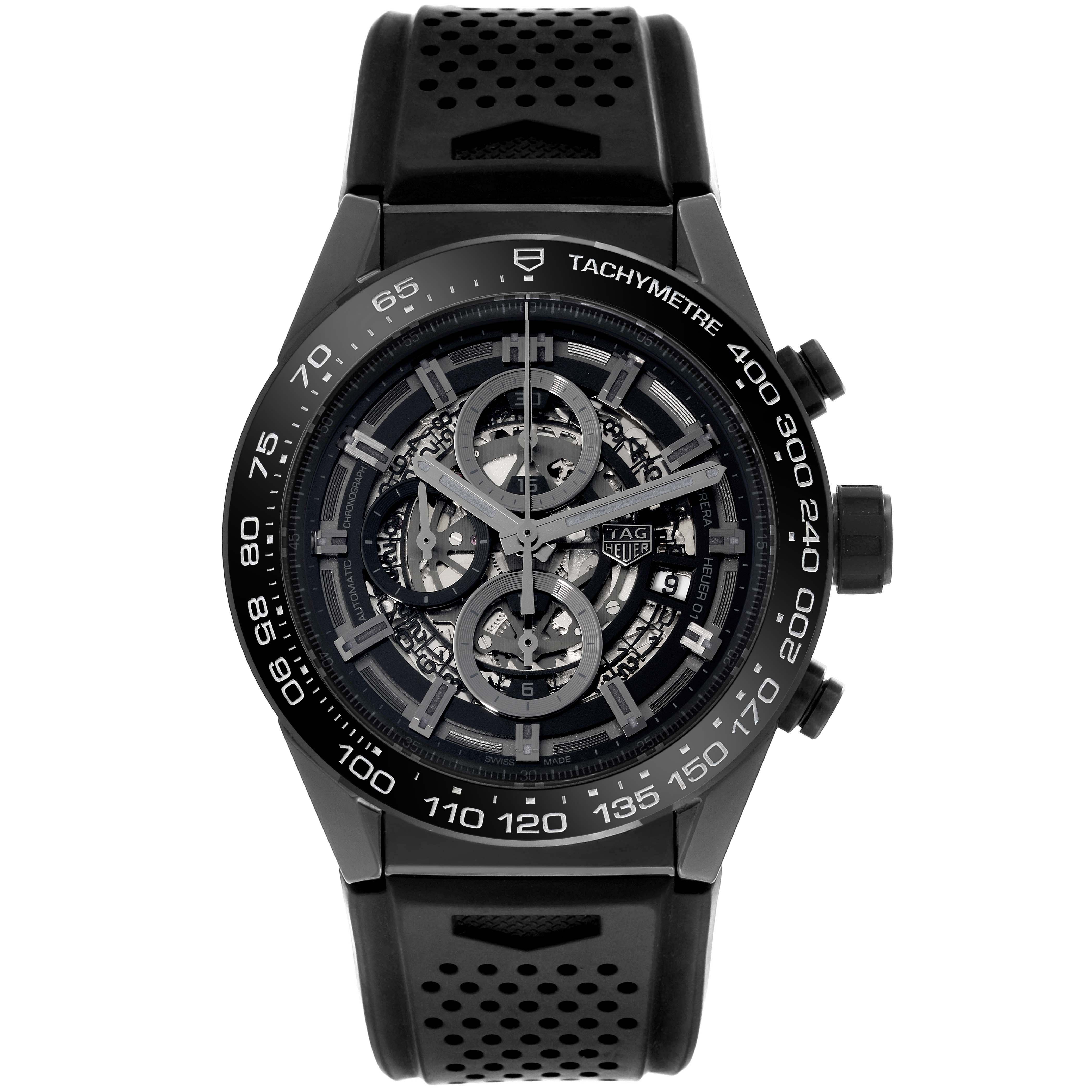 The image shows a front view of the Tag Heuer Carrera CAR2A90.FT6071 Men's Ceramic Black Dial CAR2A90.FT6071 Men's Ceramic Black Dial watch, highlighting its black perforated strap, tachymeter bezel, and exposed dial mechanics.