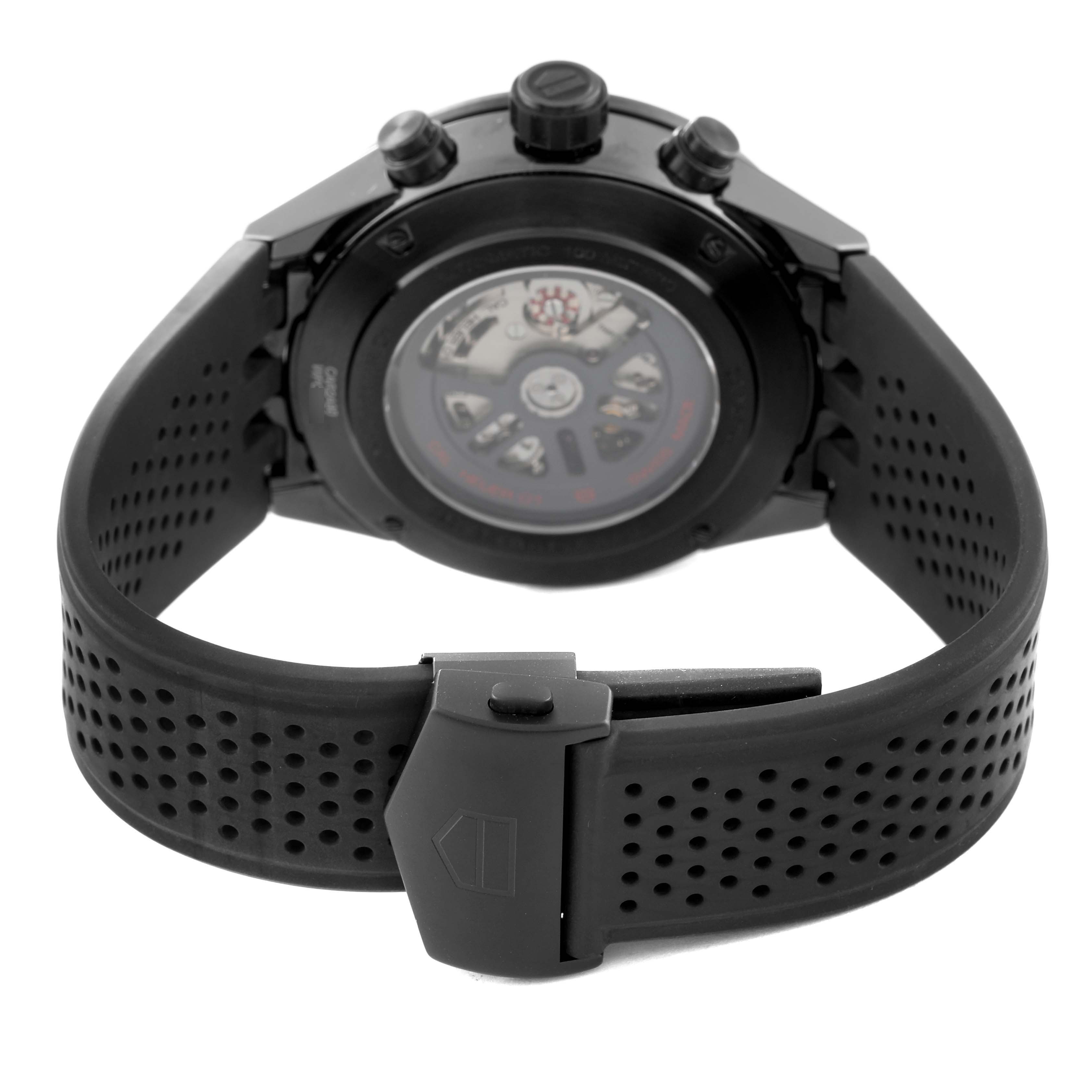 The image shows the back of a Tag Heuer Carrera CAR2A90.FT6071 Men's Ceramic Black Dial CAR2A90.FT6071 Men's Ceramic Black Dial watch, focusing on its black rubber strap and transparent case back.