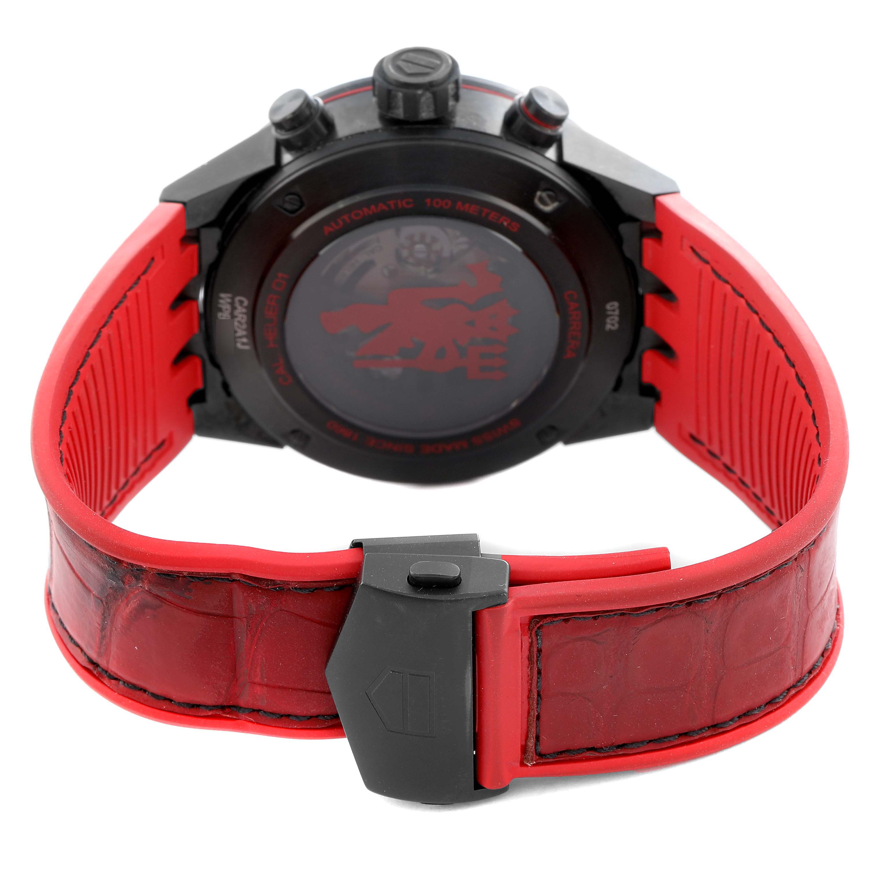 The image shows the back of a Tag Heuer Carrera CAR2A1J.FC6416 Men
s Stainless Steel Black Dial watch, highlighting the case back, red strap, and clasp.