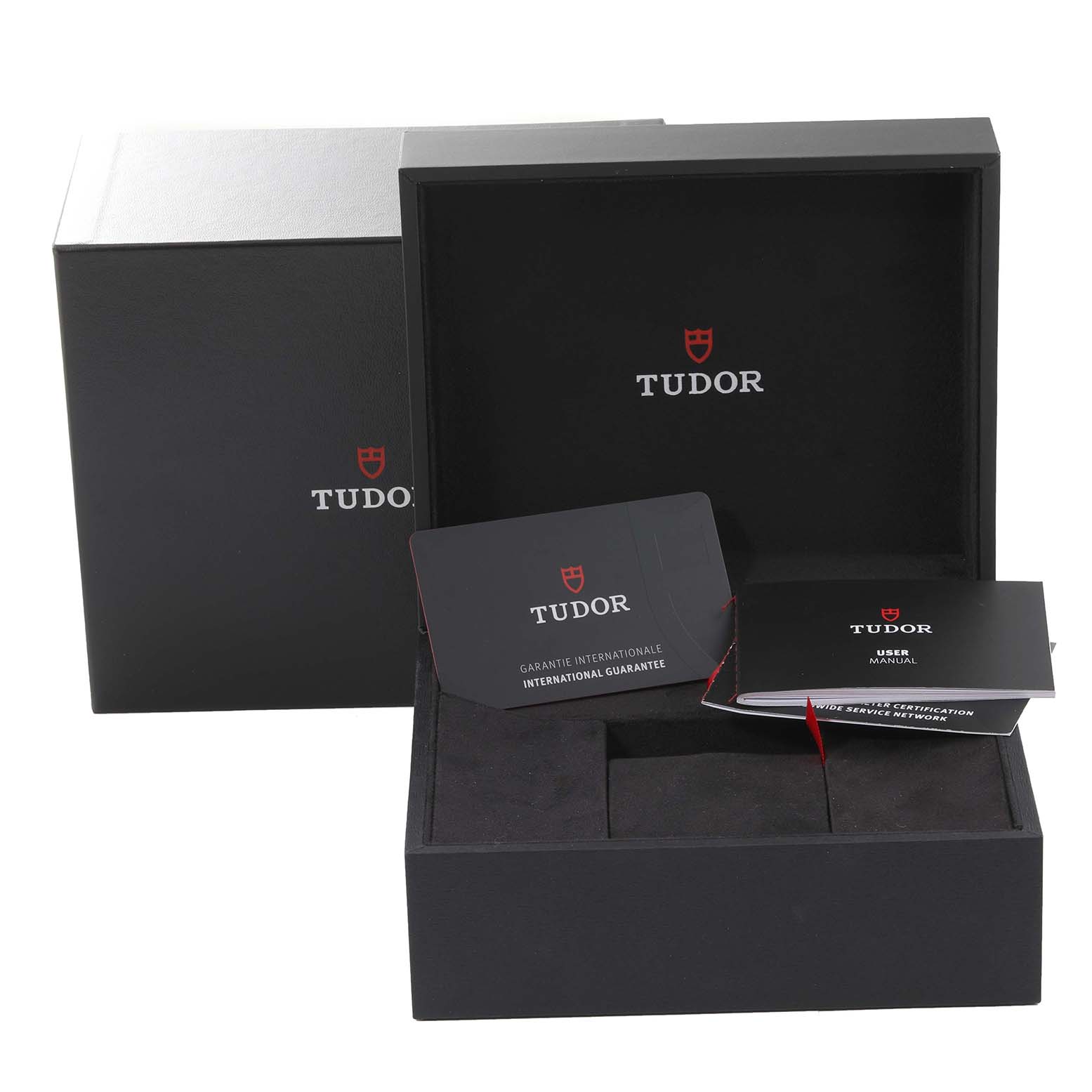 The image shows the packaging, guarantee card, and user manual for the Tudor Heritage Black Bay 79470 Men's Stainless Steel Black Dial 79470 Men's Stainless Steel Black Dial watch.