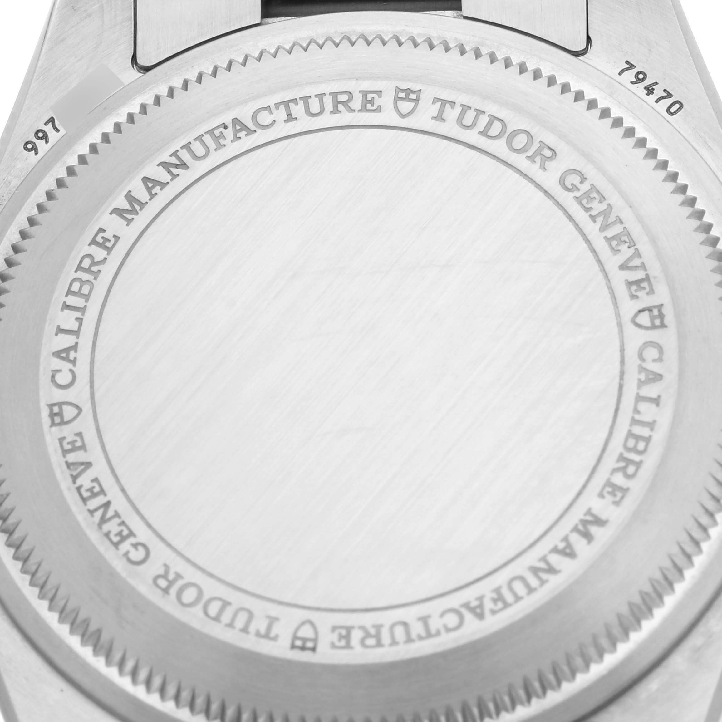 The image shows a close-up of the case back of the Tudor Heritage Black Bay 79470 Men's Stainless Steel Black Dial 79470 Men's Stainless Steel Black Dial watch, displaying the engraved brand and model details.