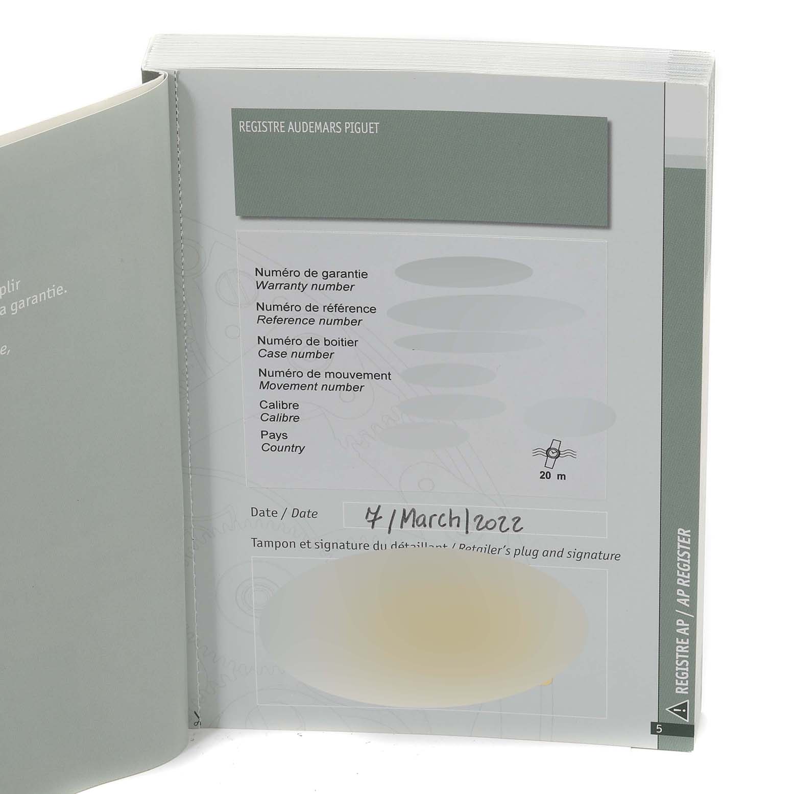 This image shows the warranty and registration booklet for the Audemars Piguet Jules 26558TI.OO.D080VE.01 Men's Titanium Green Dial 26558TI.OO.D080VE.01 Men's Titanium Green Dial model, with details like warranty number and date.