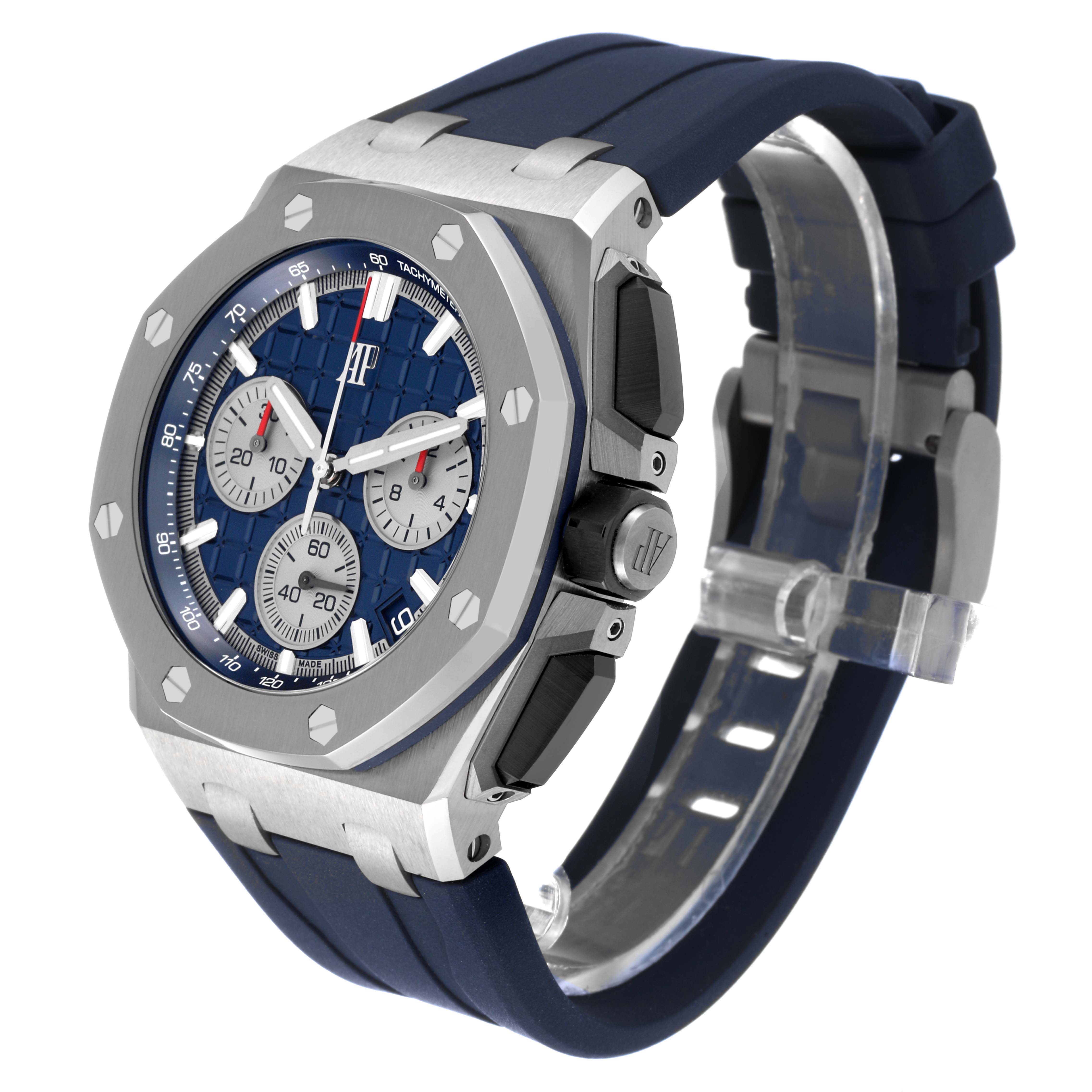 The image shows an angled side view of the Audemars Piguet Royal Oak Offshore 26420TI.OO.A027CA.01 Men's Titanium Blue Dial 26420TI.OO.A027CA.01 Men's Titanium Blue Dial watch, highlighting its face, bezel, crown, and strap.