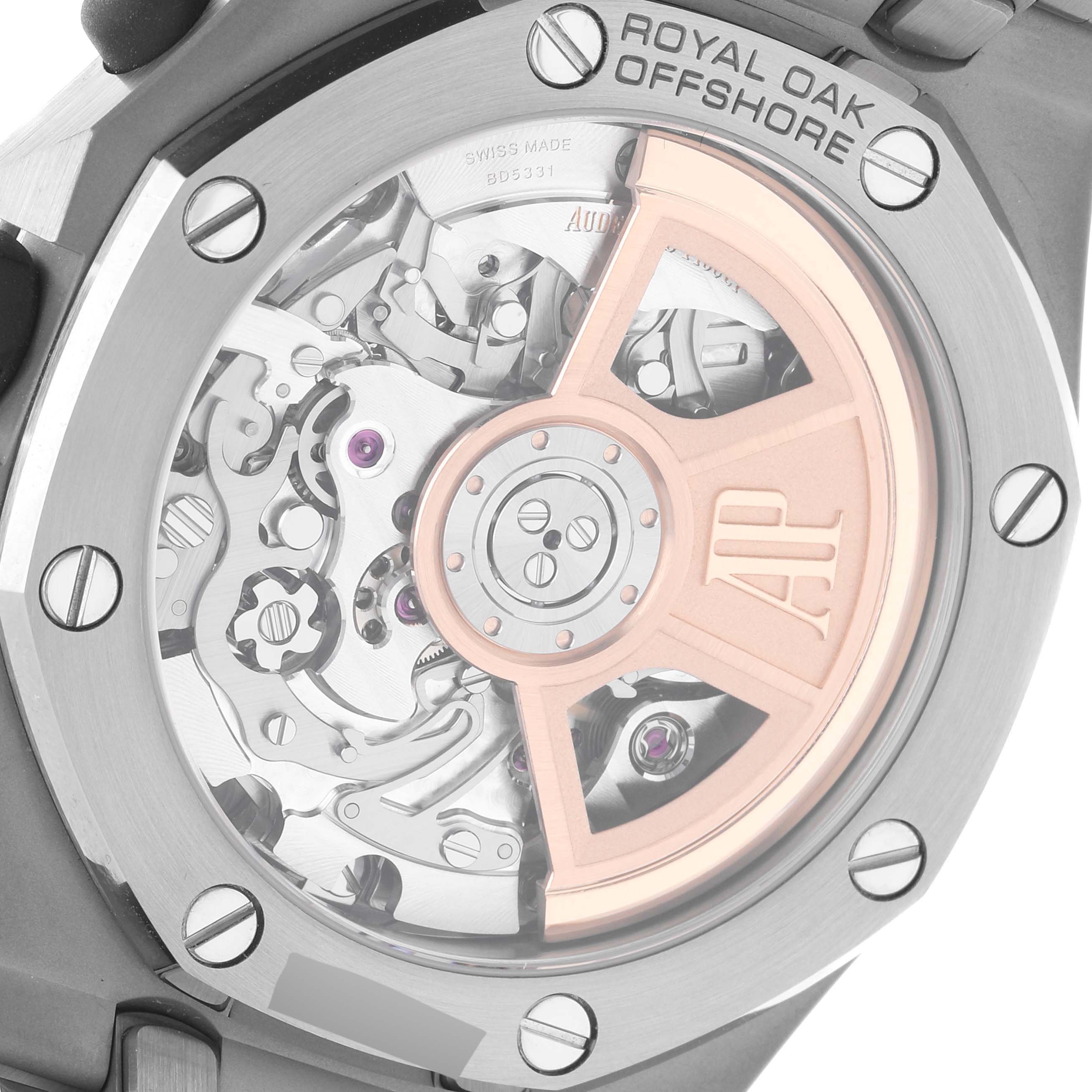 The image shows the back view of the Audemars Piguet Royal Oak Offshore 26238TI.OO.2000TI.01 Men's Titanium Grey Dial 26238TI.OO.2000TI.01 Men's Titanium Grey Dial watch, revealing its intricate mechanical movement.