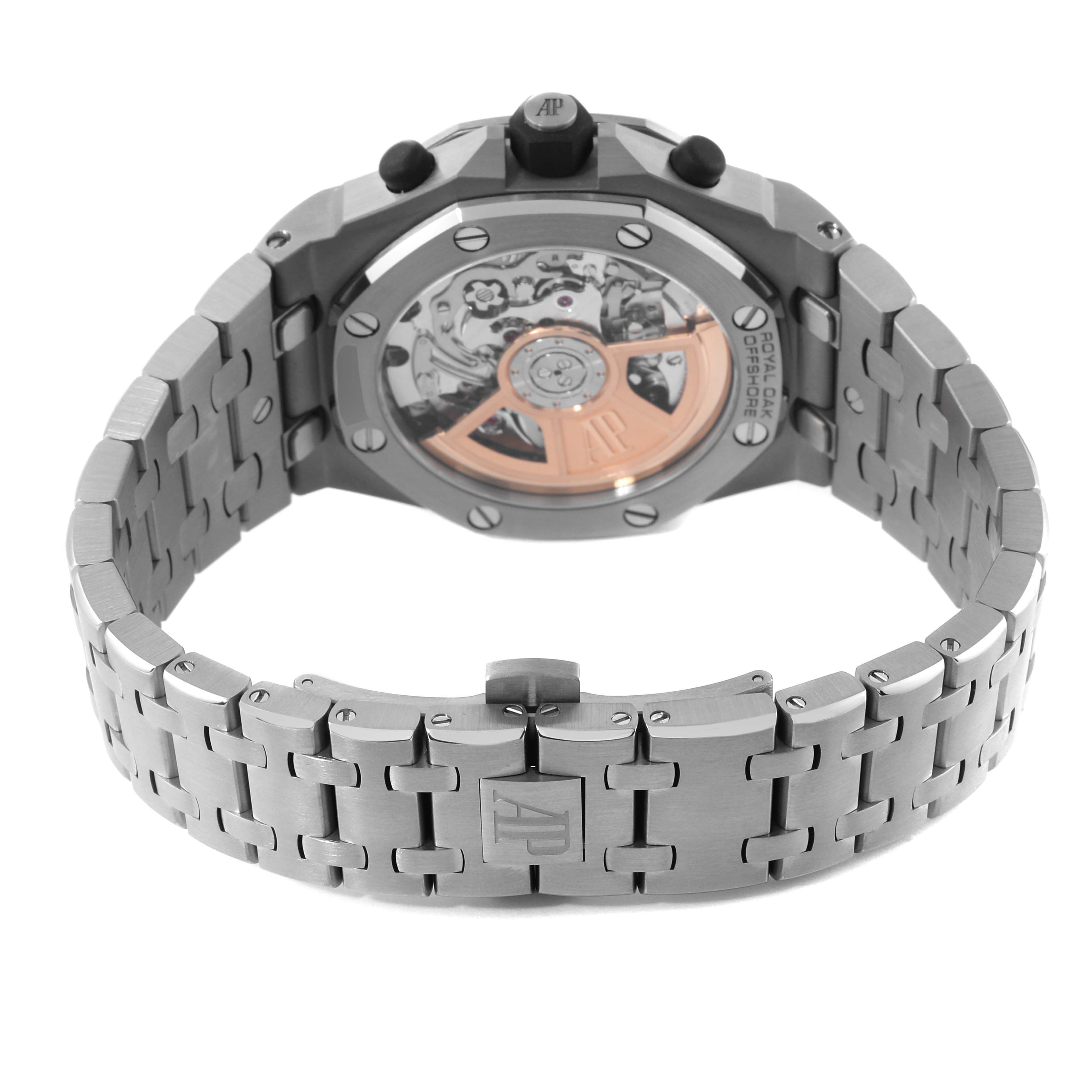 The image shows the back view of the Audemars Piguet Royal Oak Offshore 26238TI.OO.2000TI.01 Men's Titanium Grey Dial 26238TI.OO.2000TI.01 Men's Titanium Grey Dial watch, highlighting its movement and bracelet.