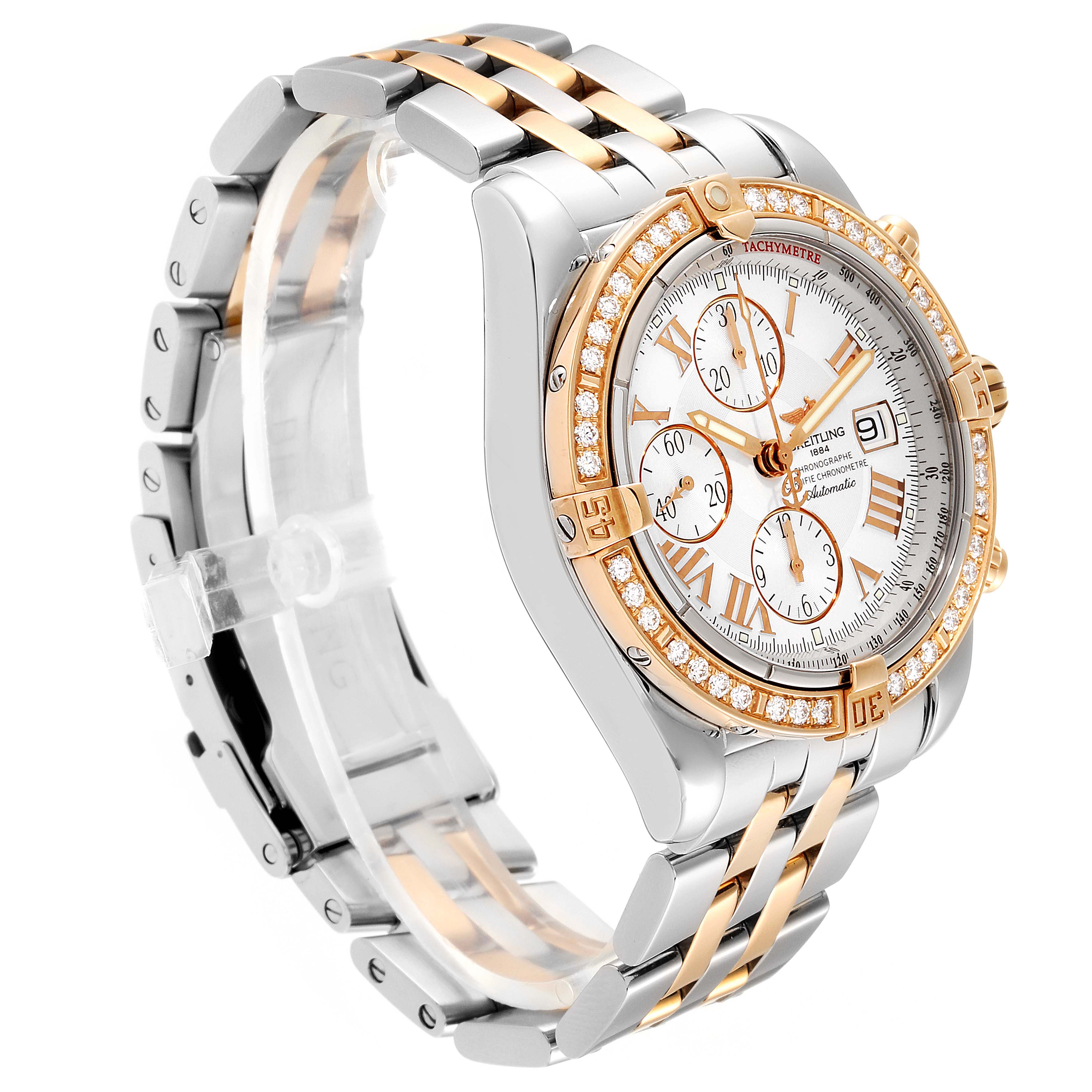 The image shows a Breitling Chronomat C13356 Men's Steel and Gold (two tone) Silver Dial C13356 Men's Steel and Gold (two tone) Silver Dial watch from a side angle, highlighting its gold and silver bracelet and diamond-encrusted bezel.