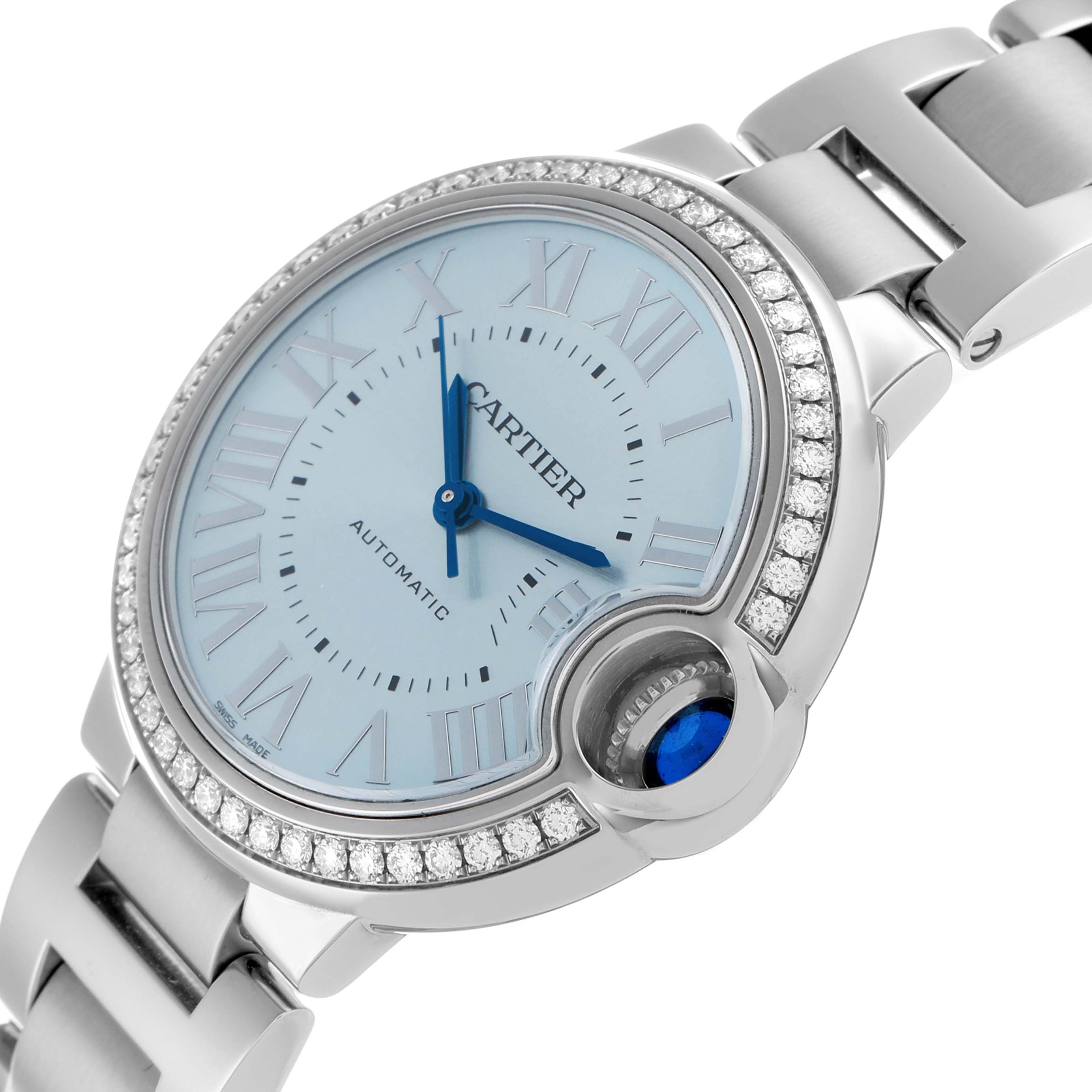 The Cartier Ballon Bleu W4BB0028 Women
s Stainless Steel Blue Dial watch is shown at a slight angle, displaying the dial, crown with blue cabochon, and diamond-set bezel.