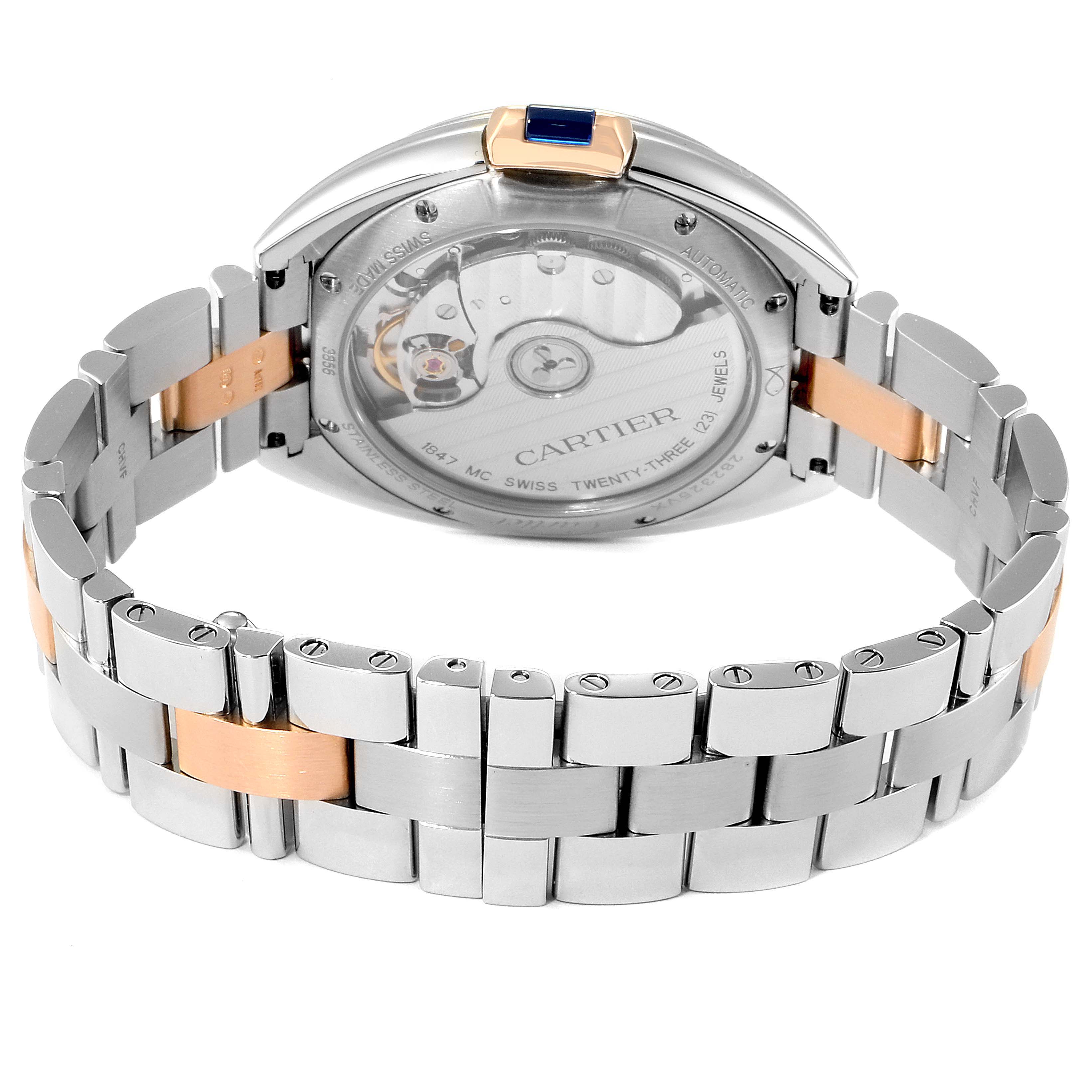 The image shows the back and bracelet of a Cartier Cle WSCL0003 Women's Steel and Gold (two tone) Blue Dial WSCL0003 Women's Steel and Gold (two tone) Blue Dial model watch, revealing the mechanical movement.