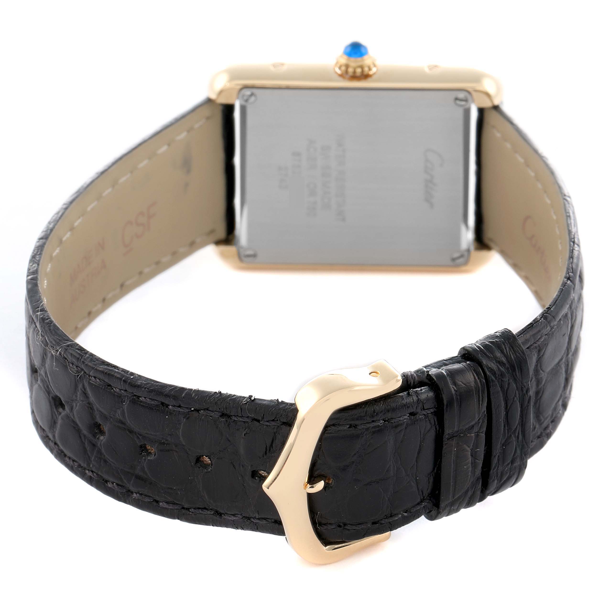 The Cartier Tank Solo W1018755 Women
s Yellow Gold Silver Dial watch is shown from the back, highlighting the strap clasp, caseback, and crown.