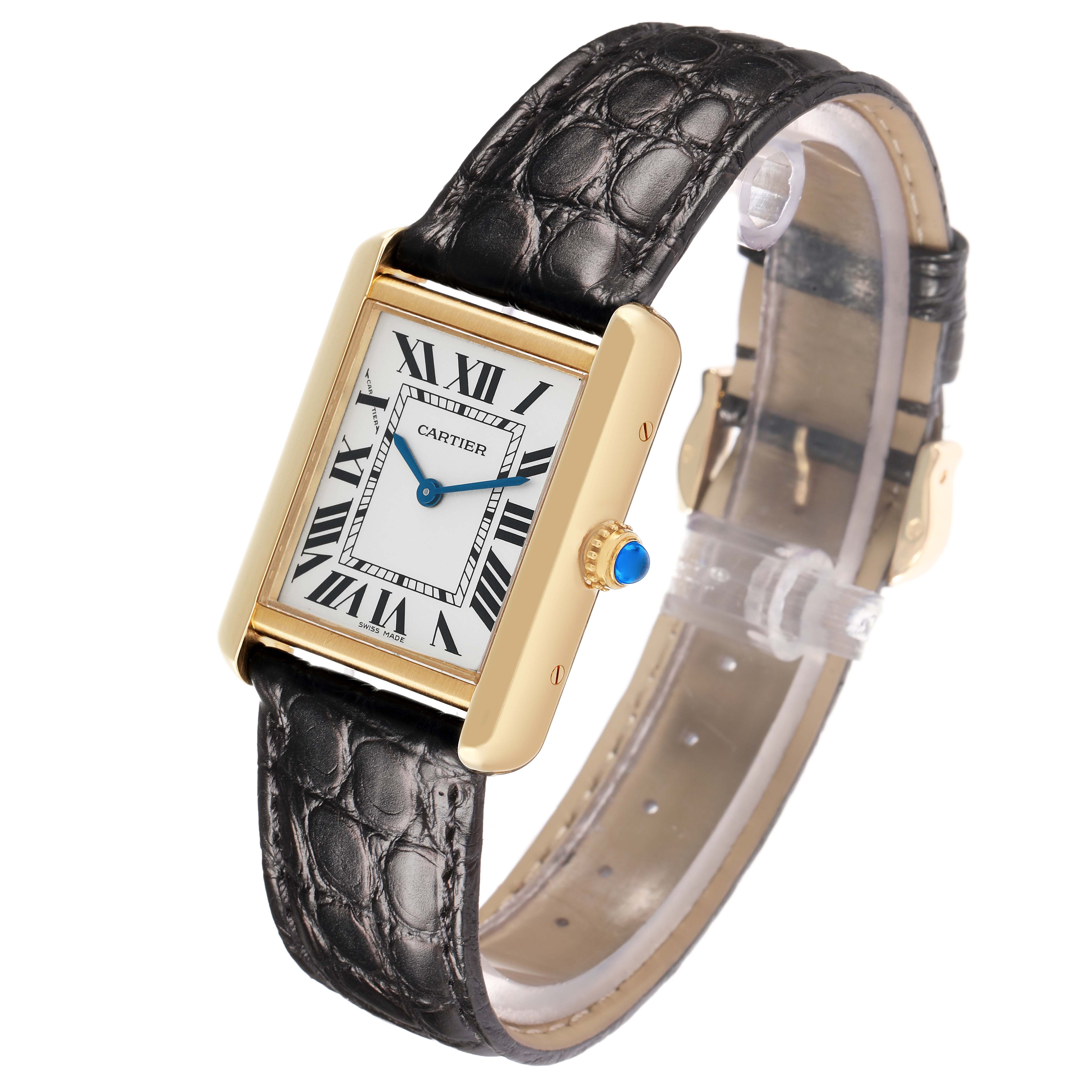 The Cartier Tank Solo W1018755 Women
s Yellow Gold Silver Dial watch is shown at a slight angle, displaying the face, strap, and crown with a blue cabochon.