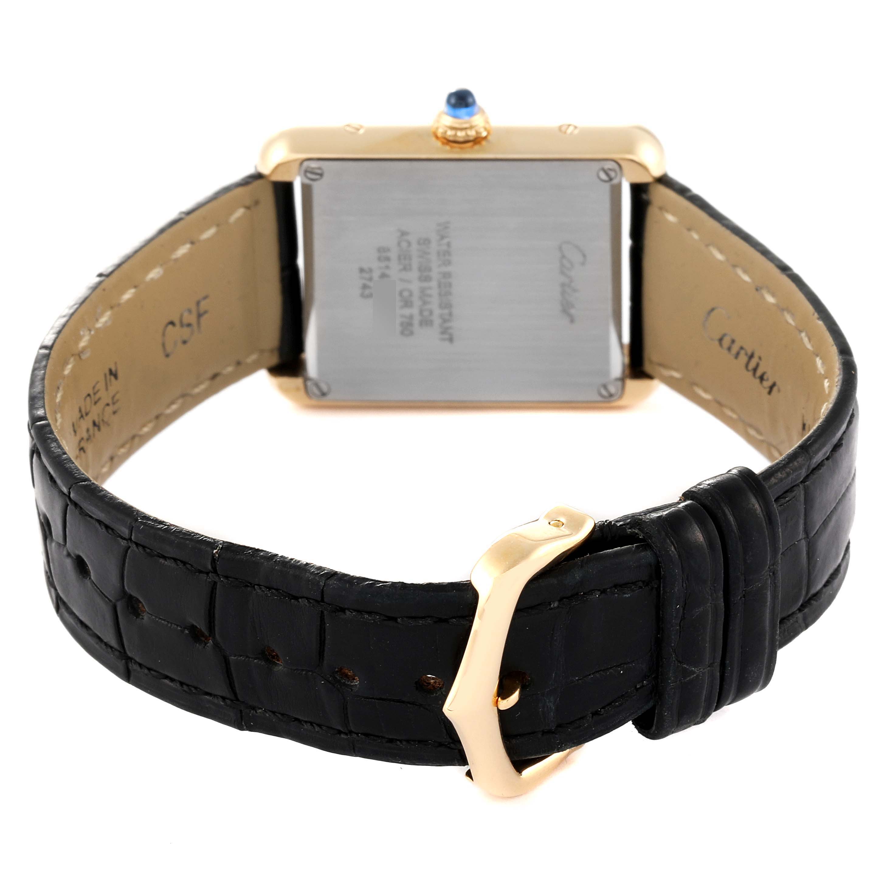 This image shows the back and strap of a Cartier Tank Solo W1018755 Women's Yellow Gold Silver Dial W1018755 Women's Yellow Gold Silver Dial watch at an angle displaying the case back and buckle.