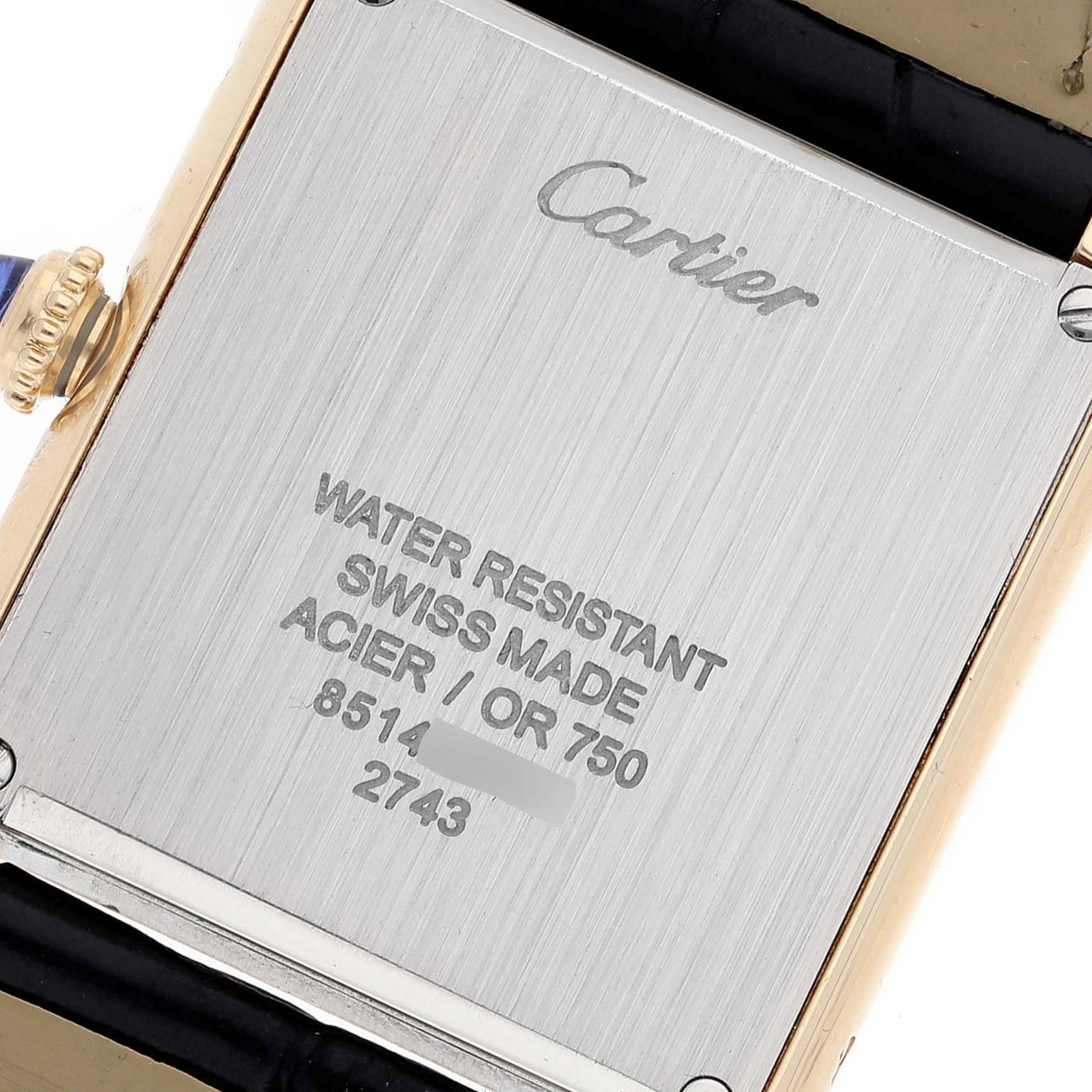 This image shows the back case of the Cartier Tank Solo W1018755 Women's Yellow Gold Silver Dial W1018755 Women's Yellow Gold Silver Dial watch, highlighting its inscriptions and crown.