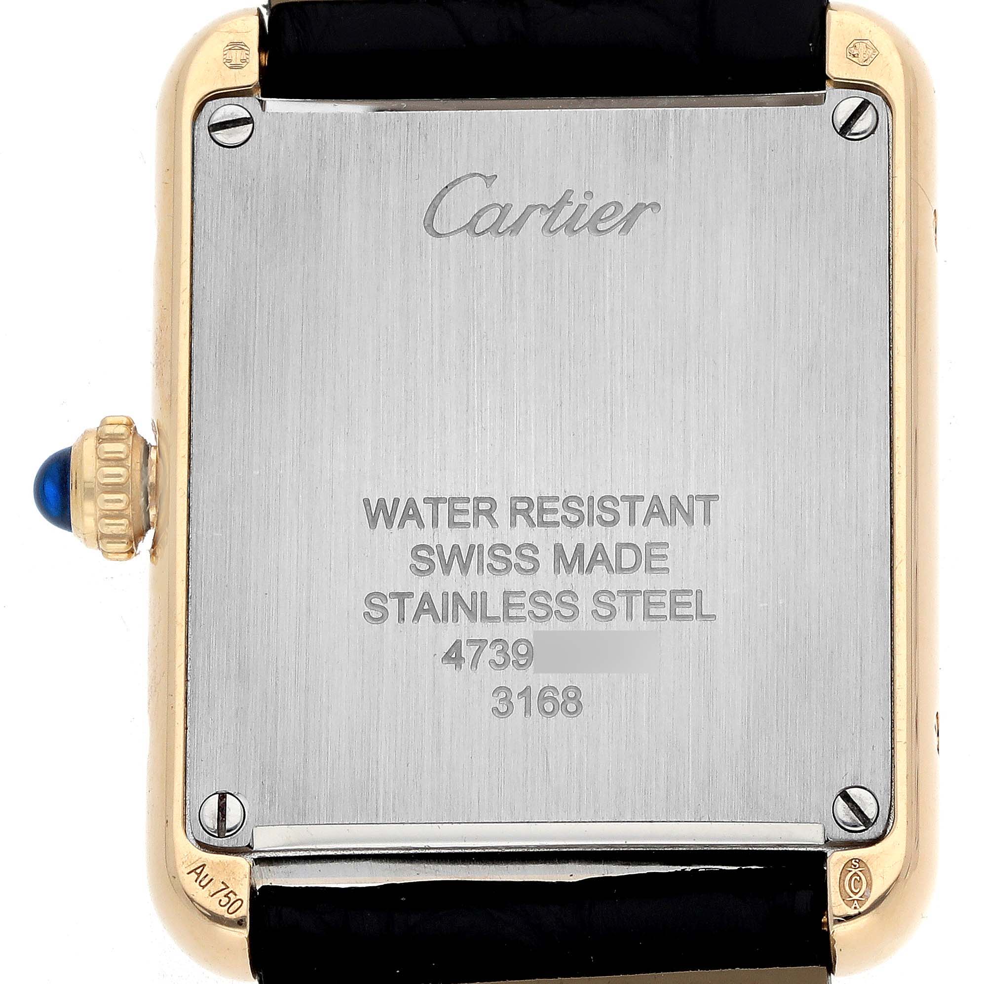 The image shows the back of a Cartier Tank Solo W5200002 Women
s Steel and Gold (two tone) Silver Dial watch, highlighting the case back, brand engraving, and strap attachments.