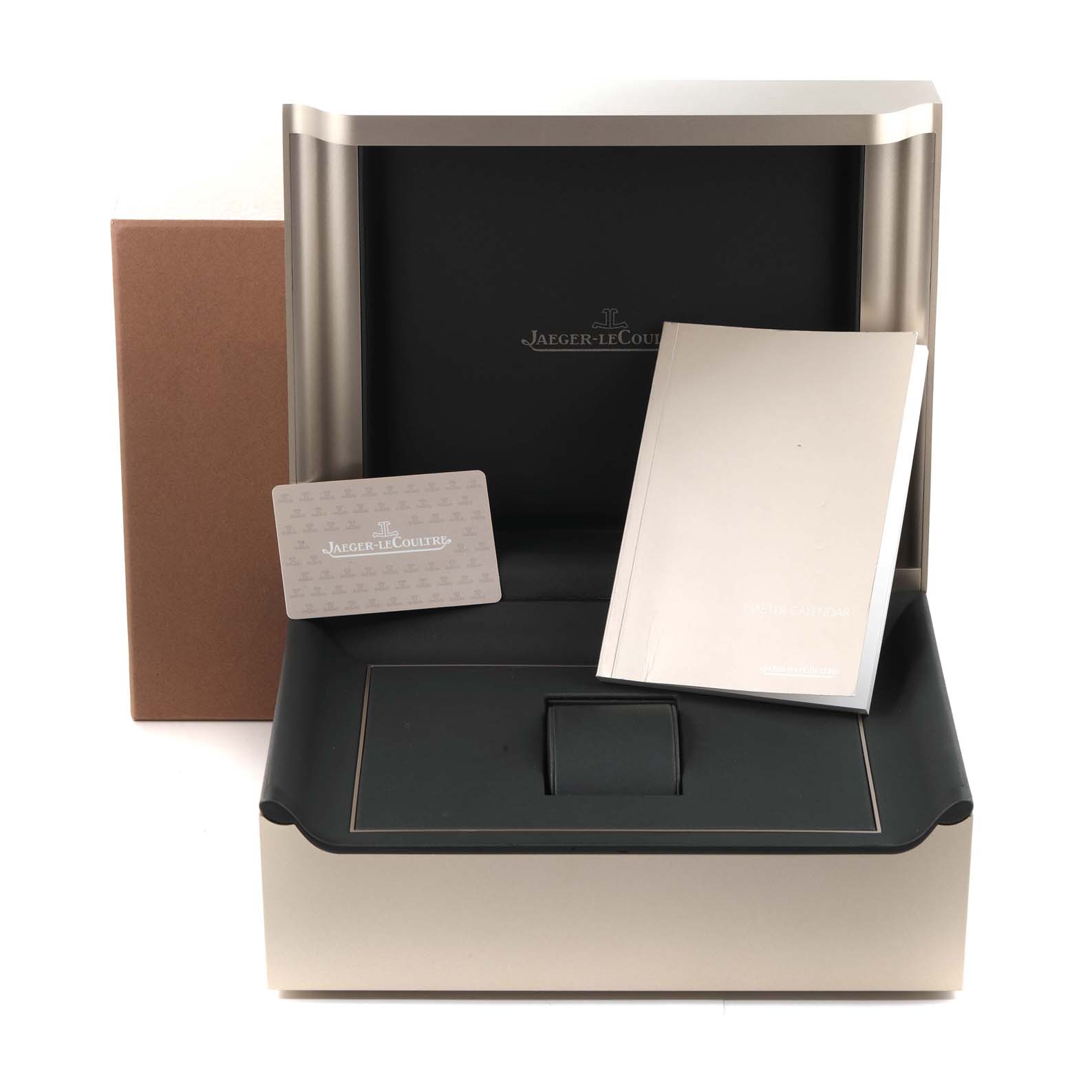 The image shows the packaging, manual, and warranty card for the Master model by Jaeger-LeCoultre, inside an open box.