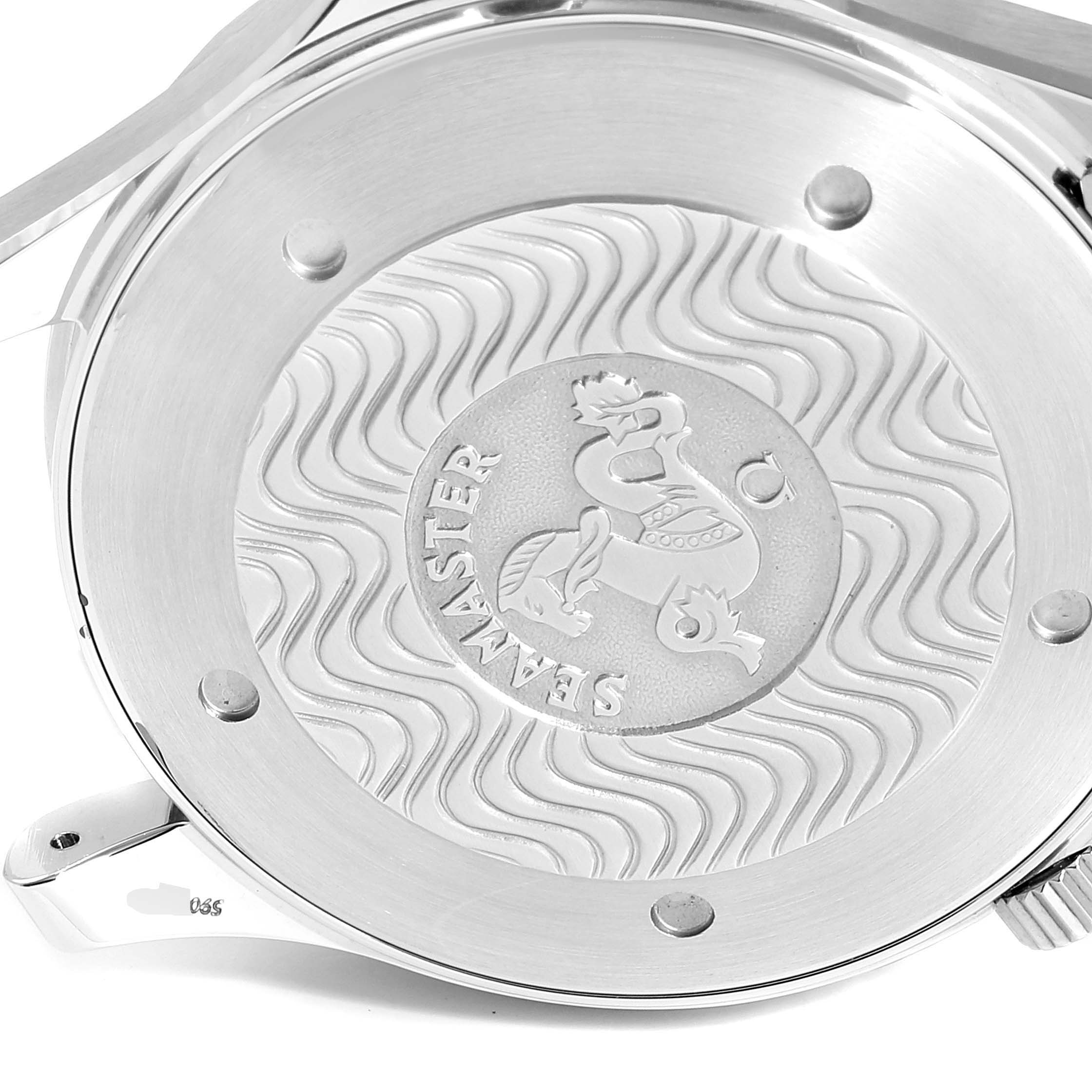 This image shows the case back of an Omega Seamaster 2264.50.00 Men's Stainless Steel Black Dial 2264.50.00 Men's Stainless Steel Black Dial watch, featuring its engraved wave design and logo.