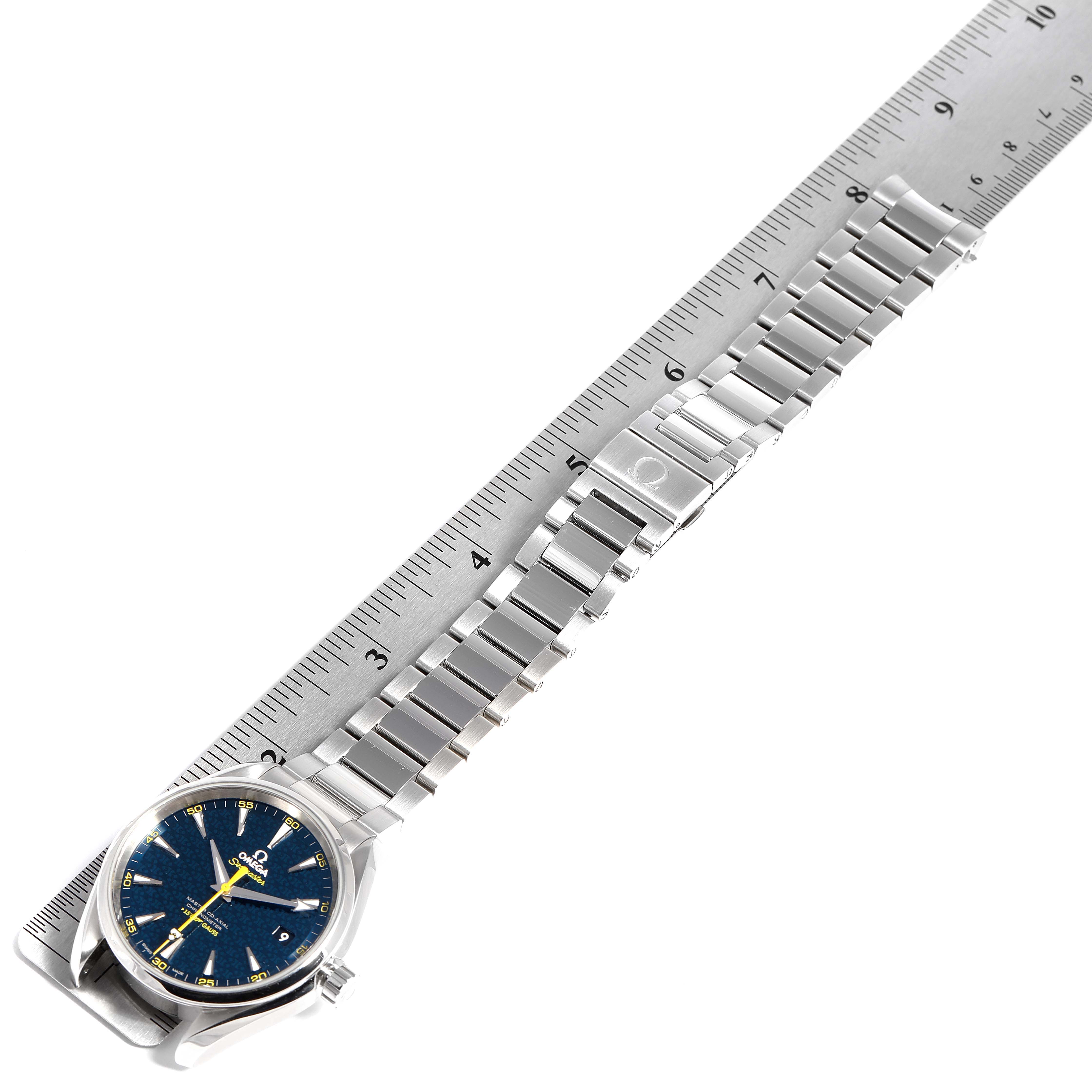 The Omega Aqua Terra 231.10.42.21.03.004 Men's Stainless Steel Blue Dial 231.10.42.21.03.004 Men's Stainless Steel Blue Dial watch is shown from a top-down angle with its bracelet aligned next to a ruler.