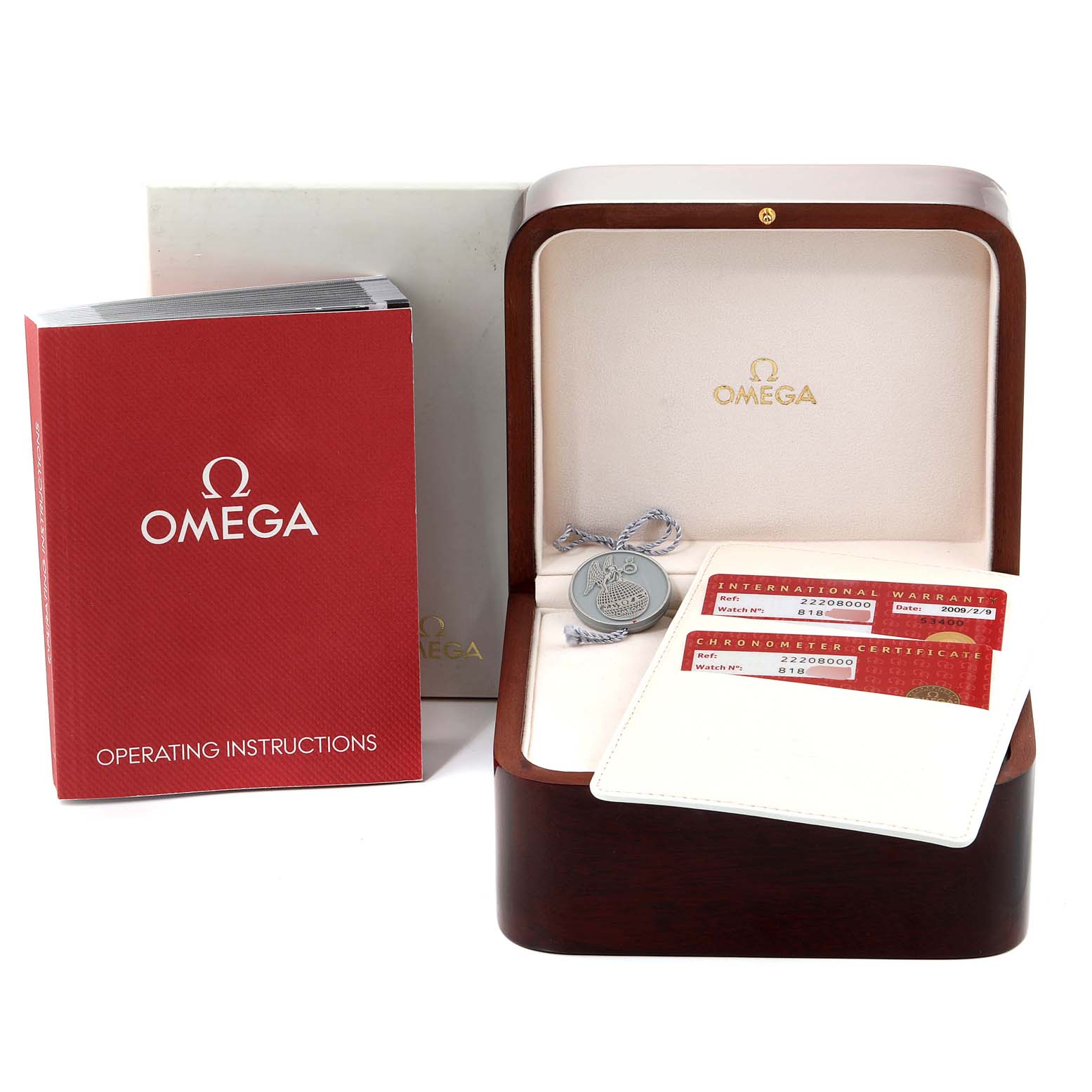 The image shows an Omega Seamaster 2220.80.00 Men's Stainless Steel Blue Dial 2220.80.00 Men's Stainless Steel Blue Dial watch box, operating instructions, warranty cards, and a medallion from a front angle.