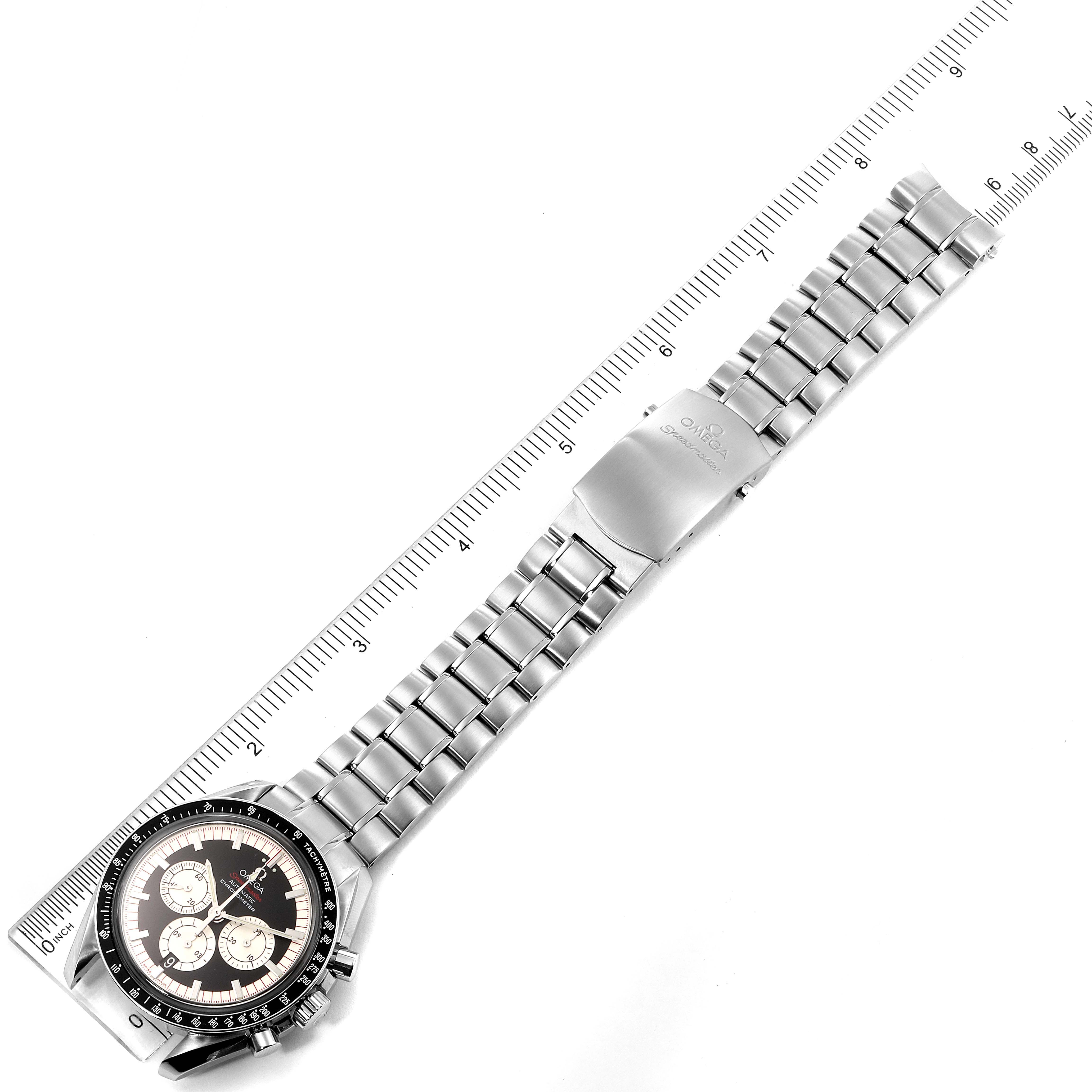 The image shows an overhead view of an Omega Speedmaster 3507.51.00 Men's Stainless Steel Black Dial 3507.51.00 Men's Stainless Steel Black Dial watch with a metal bracelet and a ruler for scale.
