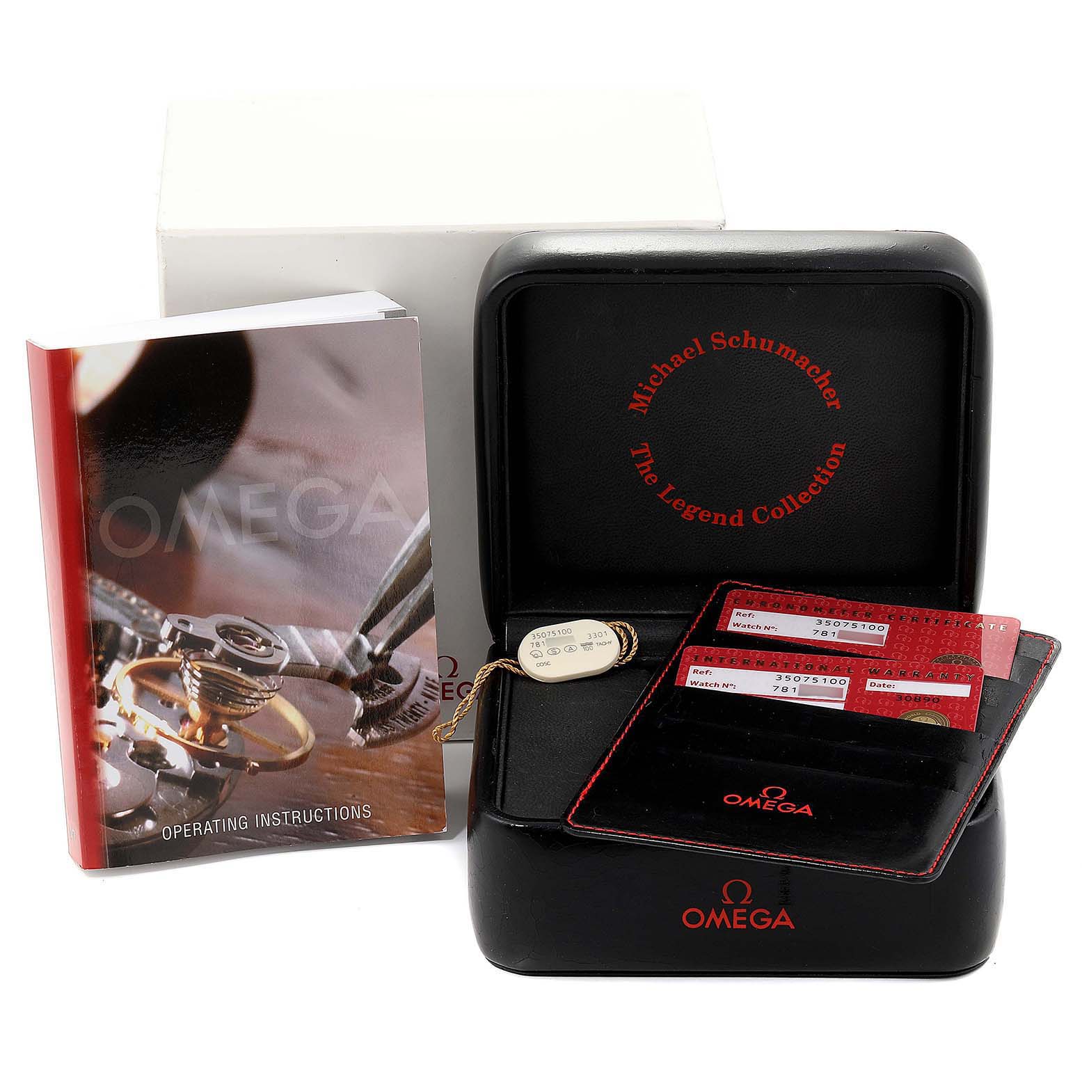 The image shows the packaging, instruction booklet, and warranty cards of an Omega Speedmaster 3507.51.00 Men's Stainless Steel Black Dial 3507.51.00 Men's Stainless Steel Black Dial watch from the Michael Schumacher Legend Collection.