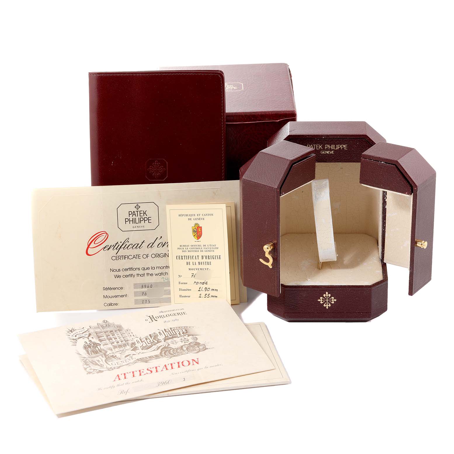 This image shows the packaging, certificates, and documentation for a Patek Philippe Calatrava 3960 Men's Yellow Gold Silver Dial 3960 Men's Yellow Gold Silver Dial watch.