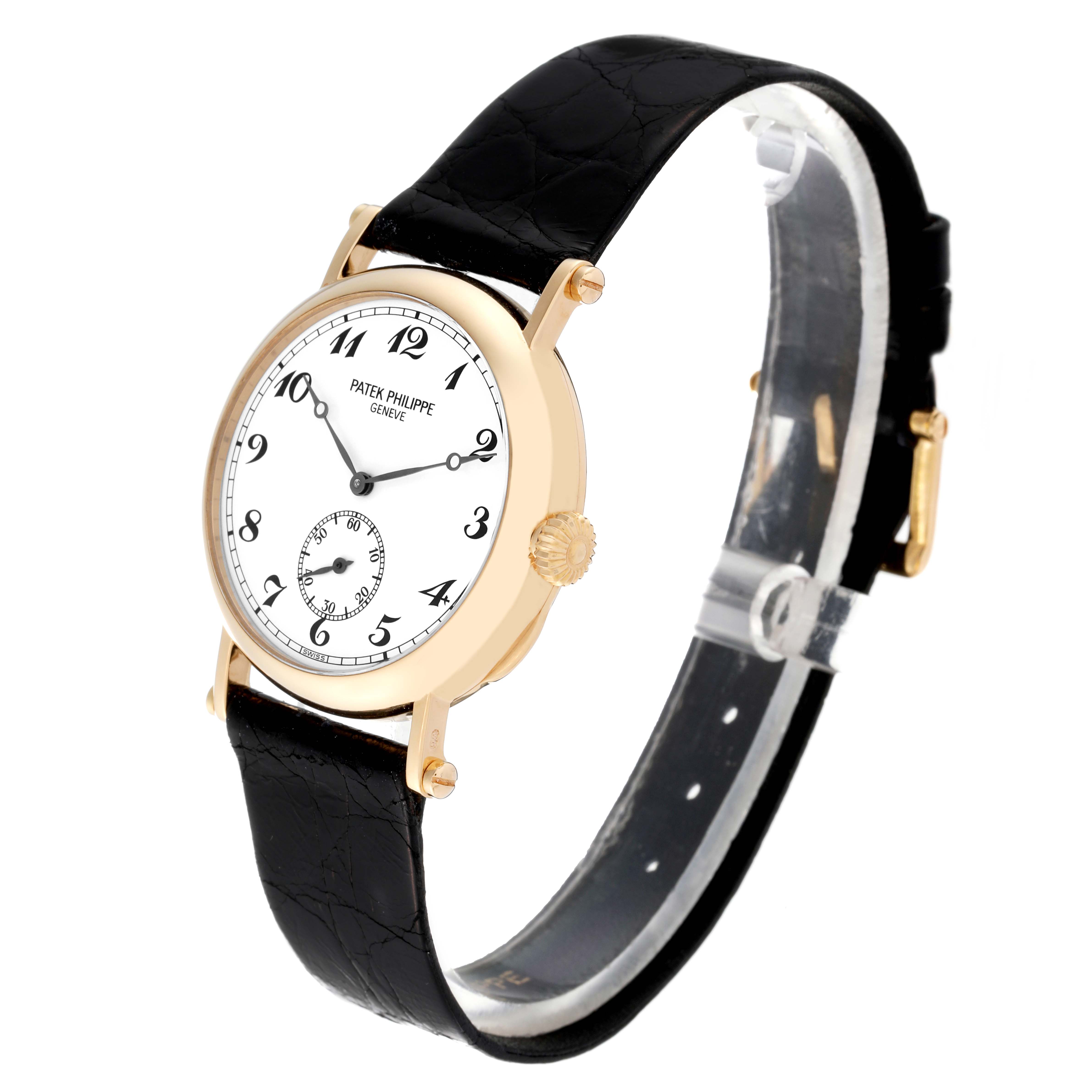 This image shows the Patek Philippe Calatrava 3960 Men's Yellow Gold Silver Dial 3960 Men's Yellow Gold Silver Dial model watch at a slight angle, displaying the face, crown, and black leather strap.