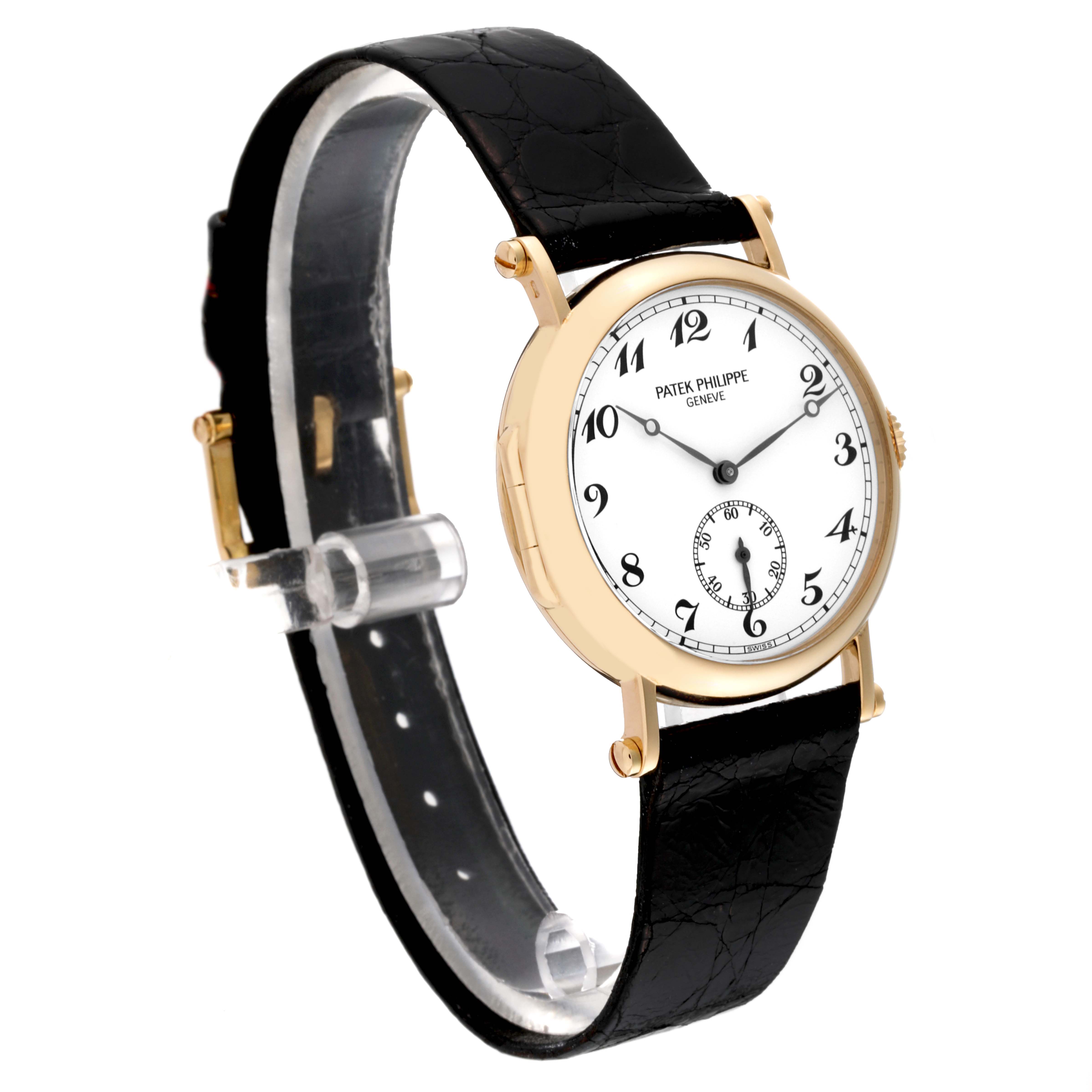 The image shows a side angle view of a Patek Philippe Calatrava 3960 Men's Yellow Gold Silver Dial 3960 Men's Yellow Gold Silver Dial watch, highlighting its black leather strap and gold case.