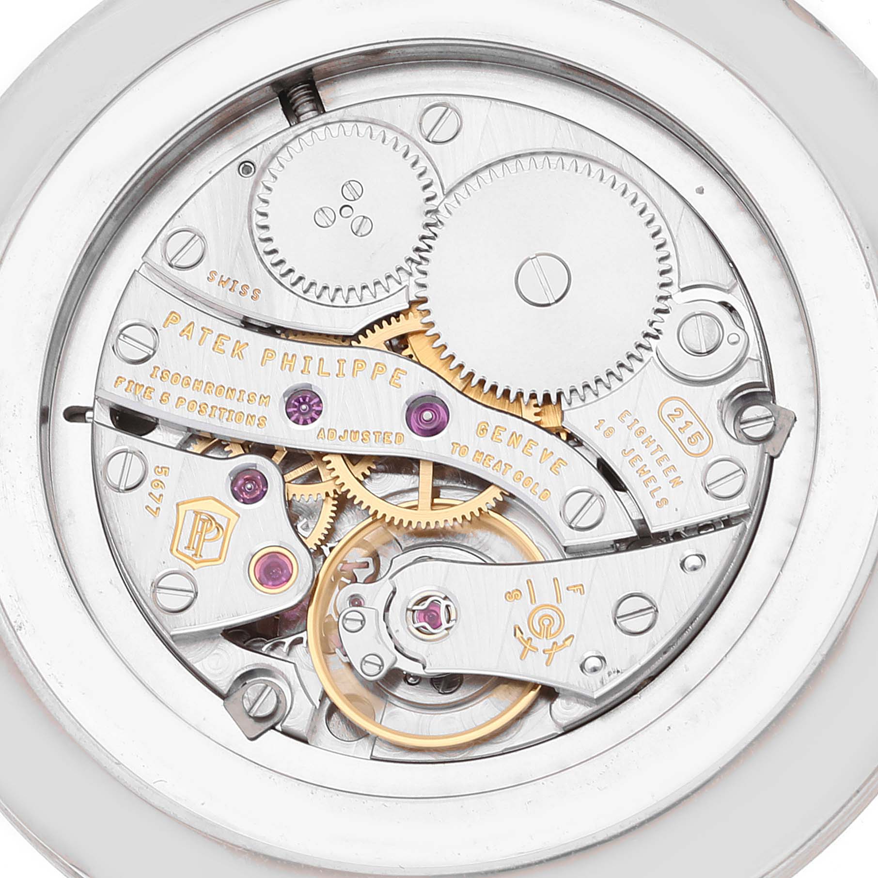 This image shows the intricate inner workings and mechanical movements of the Patek Philippe Calatrava 5119 Men's White Gold White Dial 5119 Men's White Gold White Dial watch from a backside angle.