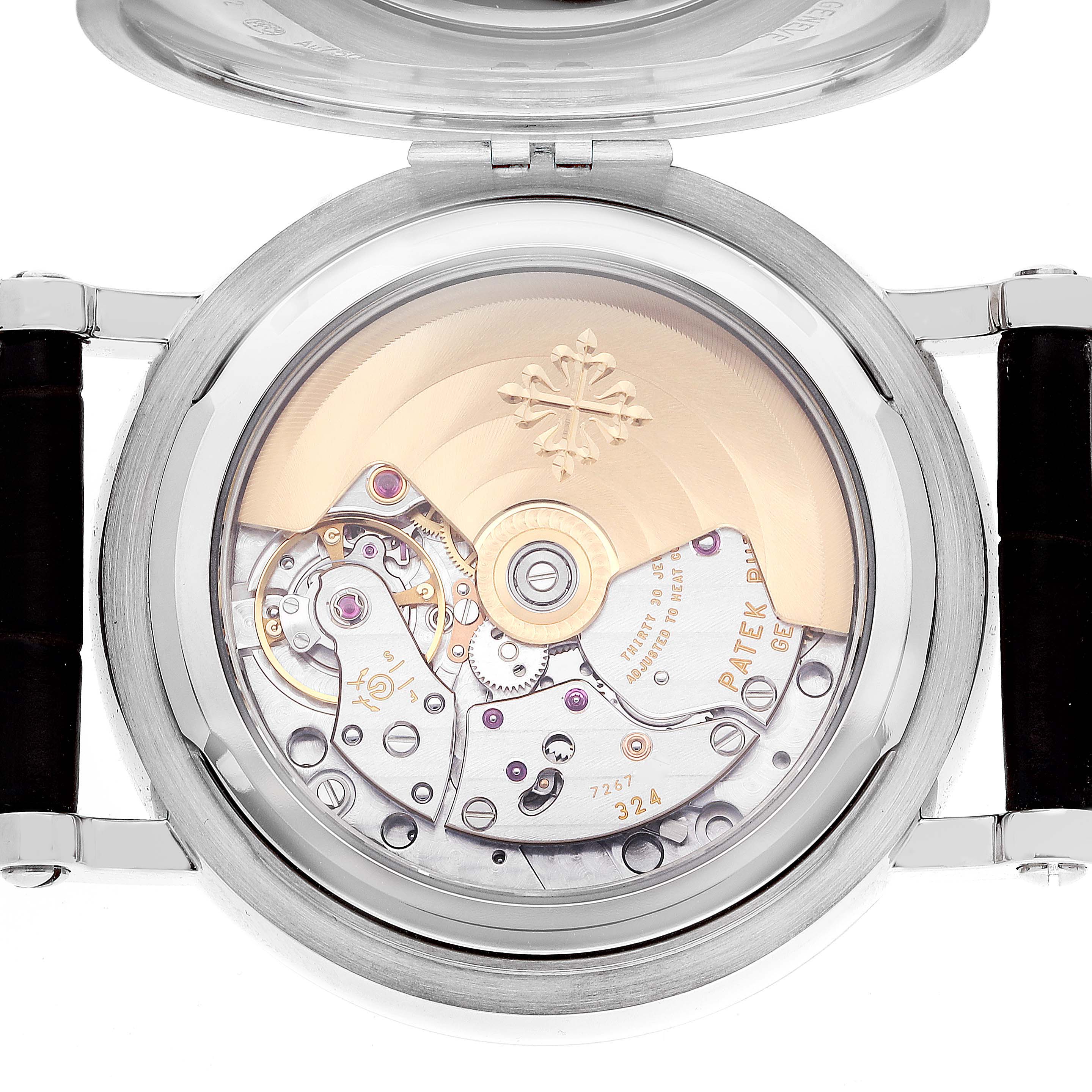 This image shows the open case back of a Patek Philippe Complications 5159G-001 Men's White Gold Silver Dial 5159G-001 Men's White Gold Silver Dial model, displaying its intricate mechanical movement.