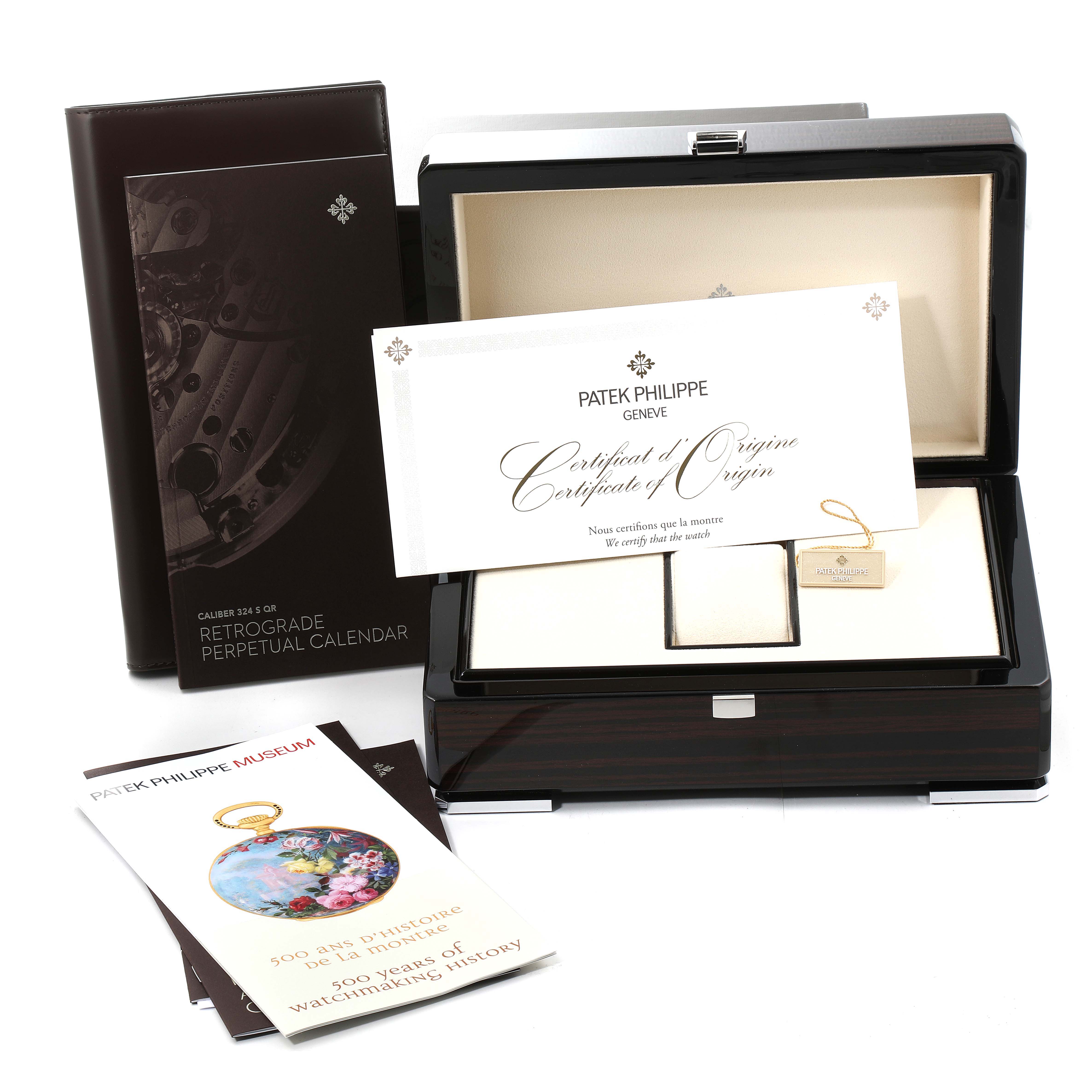 The image shows the packaging, certificate, and presentation box for the Patek Philippe Complications 5159G-001 Men's White Gold Silver Dial 5159G-001 Men's White Gold Silver Dial model watch.