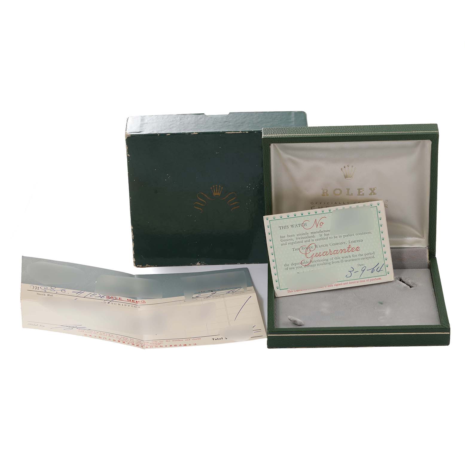 The image shows the box, warranty card, and papers for a Vintage Collection model by Rolex.