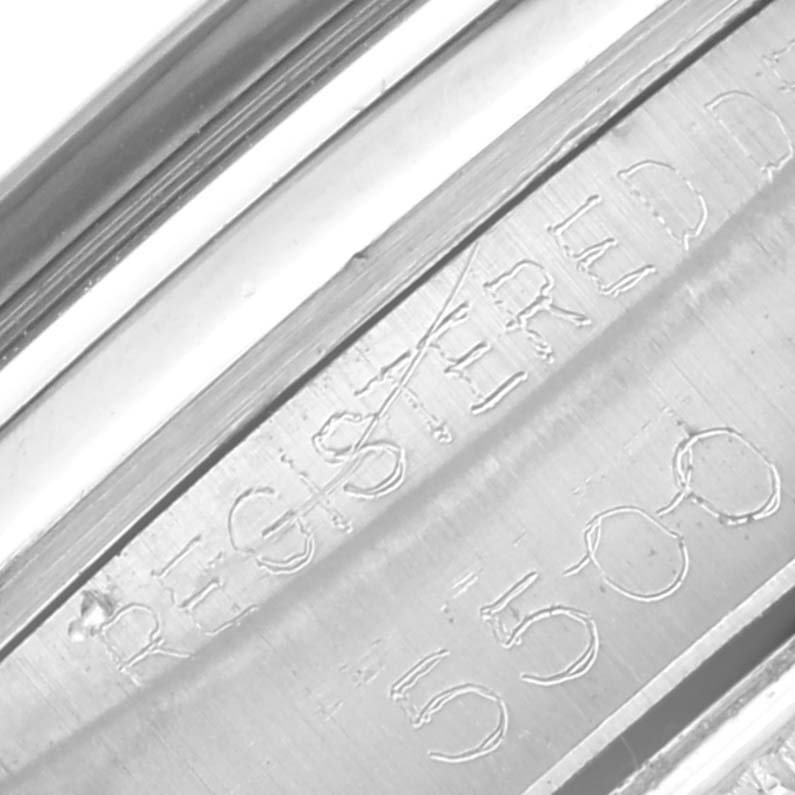 The image shows the inner case back of the Rolex Vintage Collection 5500 Men
s Stainless Steel Black Dial 5500 Men
s Stainless Steel Black Dial model, with engraved text and serial numbers.