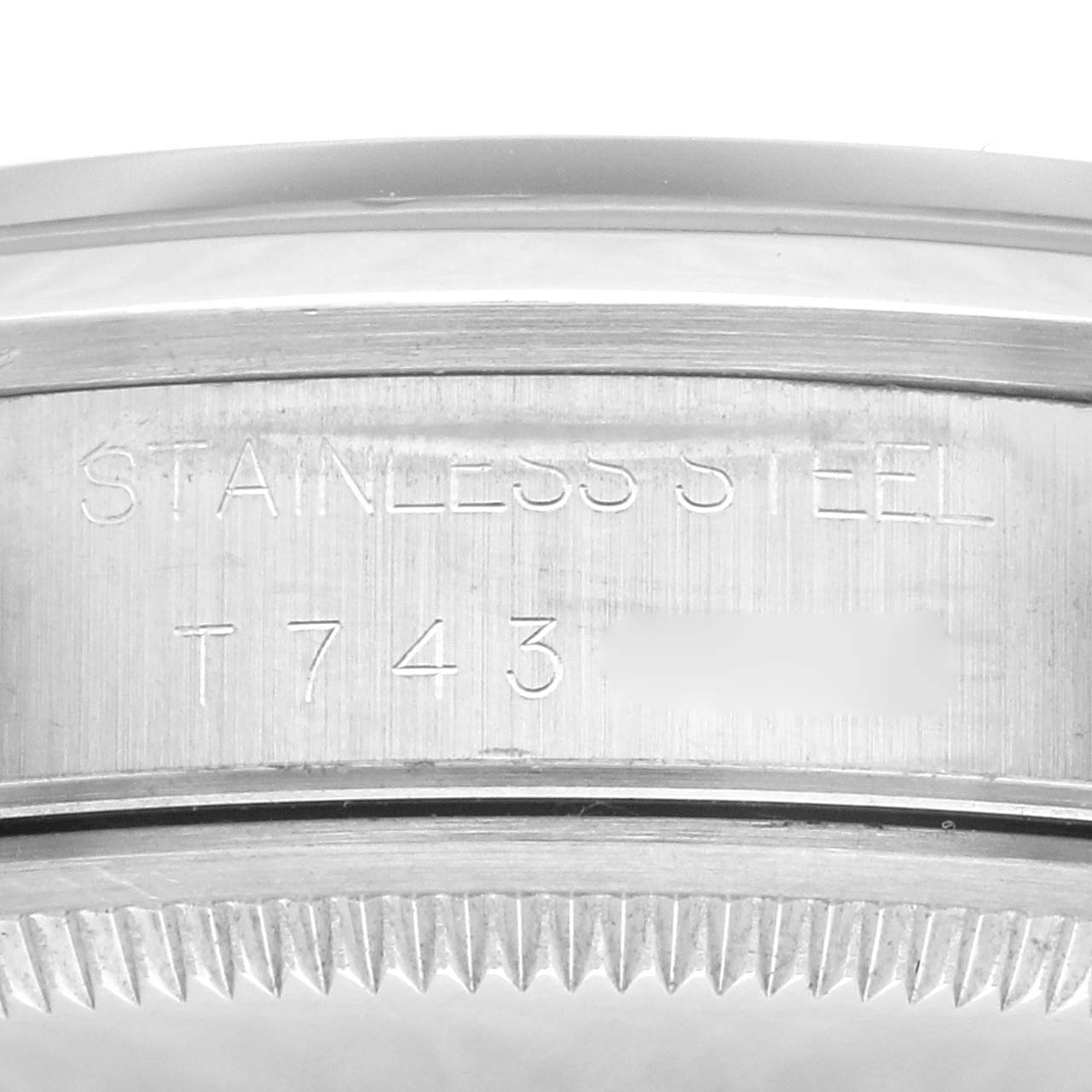 This image shows a close-up of the case side and part of the bezel with engravings on the Rolex Air-King 14000 Men's Stainless Steel White Dial 14000 Men's Stainless Steel White Dial stainless steel watch.