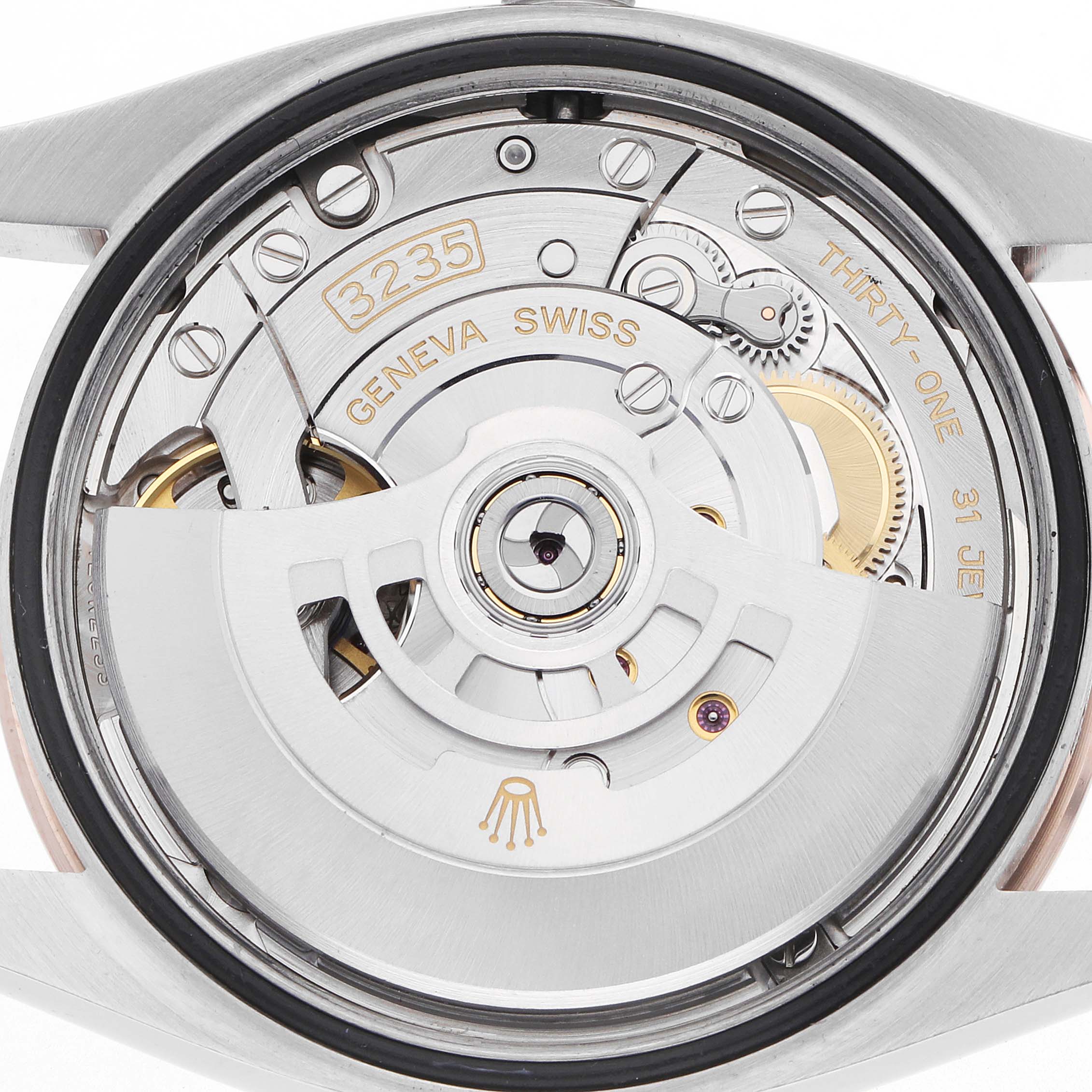 The image shows a back view of the Rolex Datejust 126231 Men's Steel and Gold (two tone) White Dial, highlighting the movement and rotor.