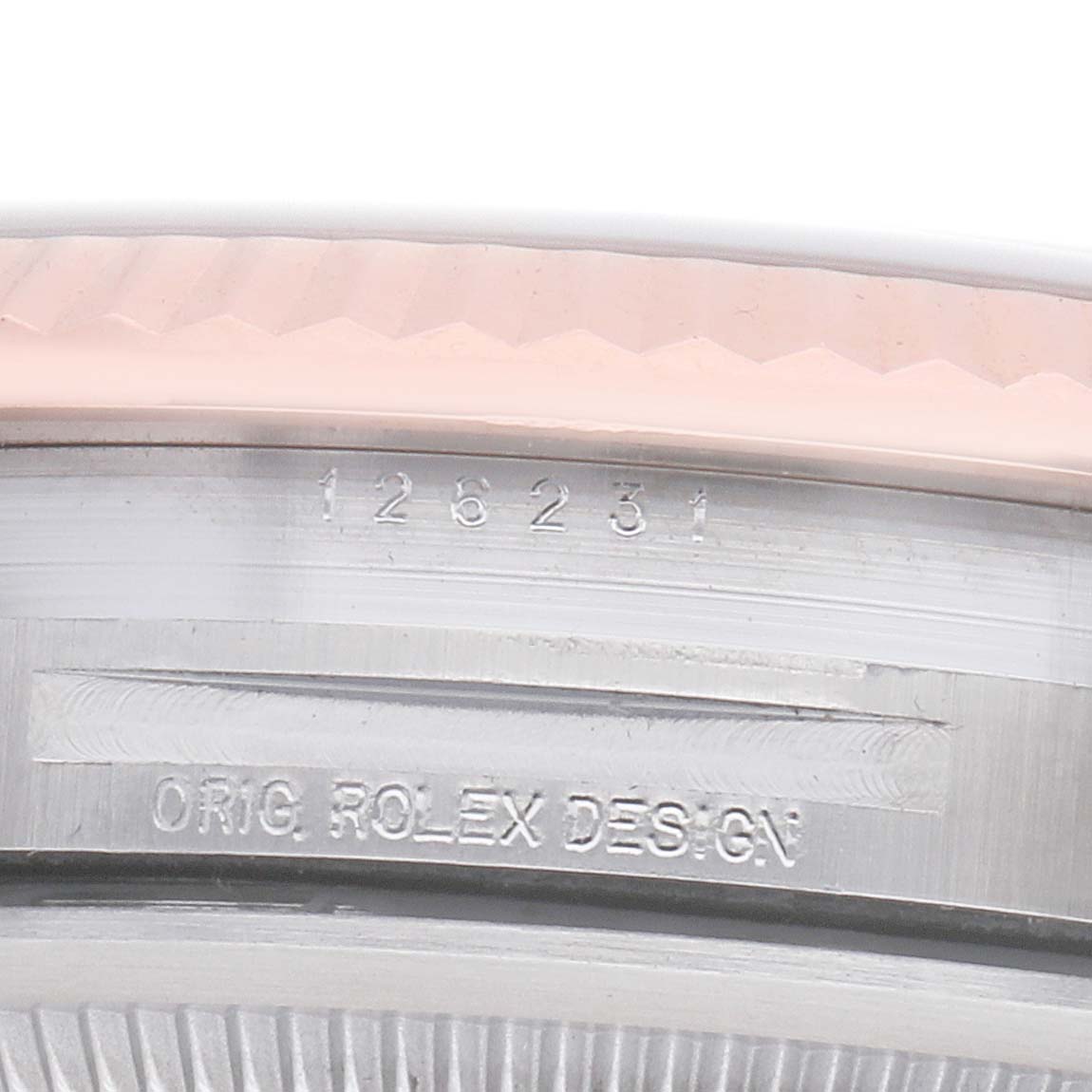 The image shows a close-up of the bezel and case edge with inscriptions on a Rolex Datejust 126231 Men's Steel and Gold (two tone) White Dial watch.
