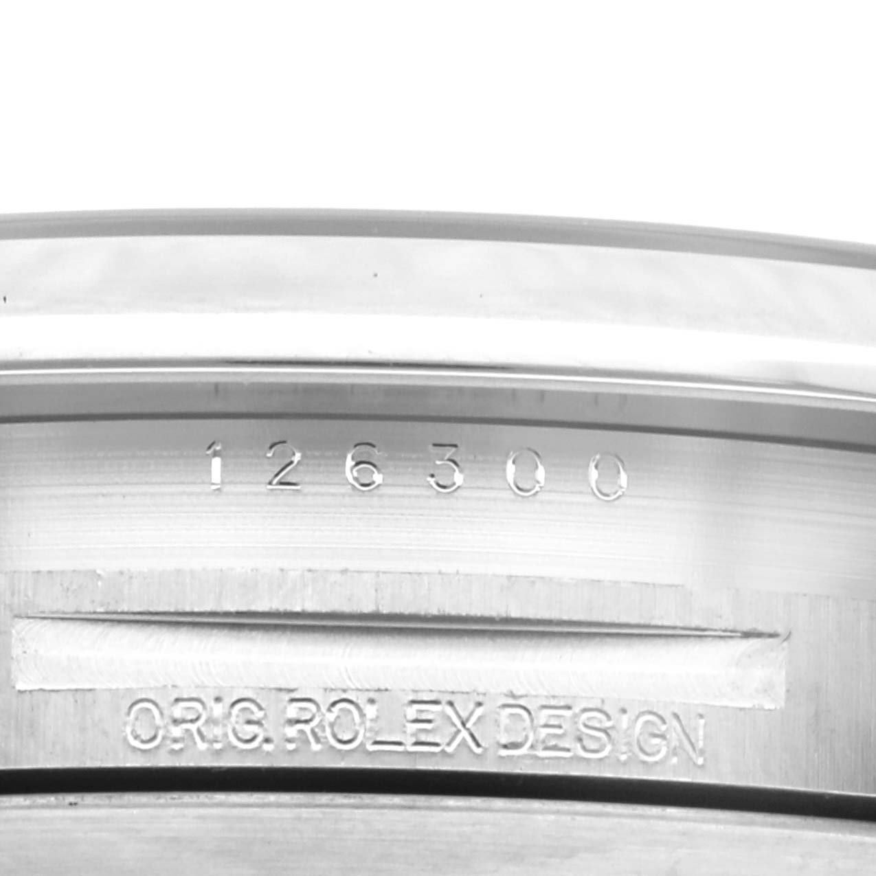 The image shows an angled close-up of the model number and "Orig Rolex Design" engraving on the inner bezel of a Rolex Datejust 41 126300 Men's Stainless Steel Blue Dial 126300 Men's Stainless Steel Blue Dial.