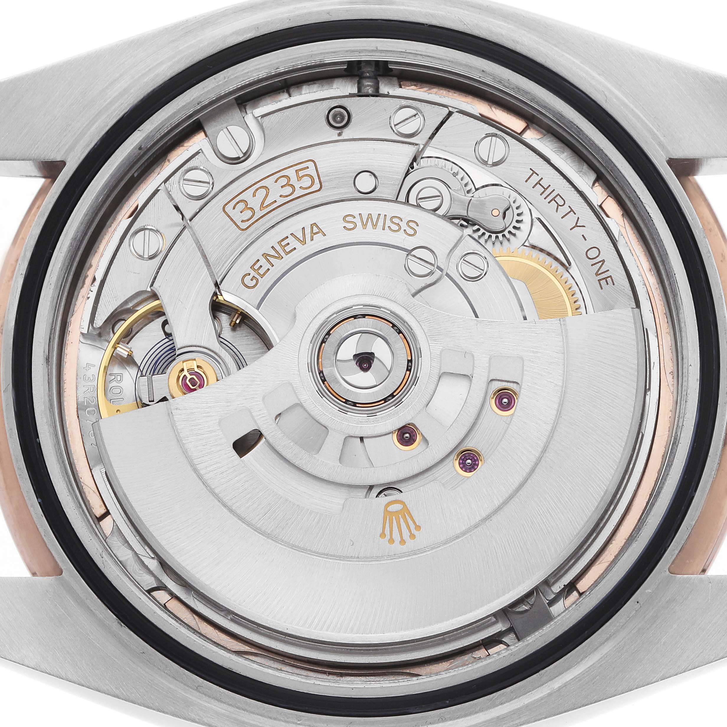 The image shows the movement of a Rolex Datejust 41 126331 Men
s Steel and Gold (two tone) Pink Dial from the back, displaying gears and the automatic rotor.