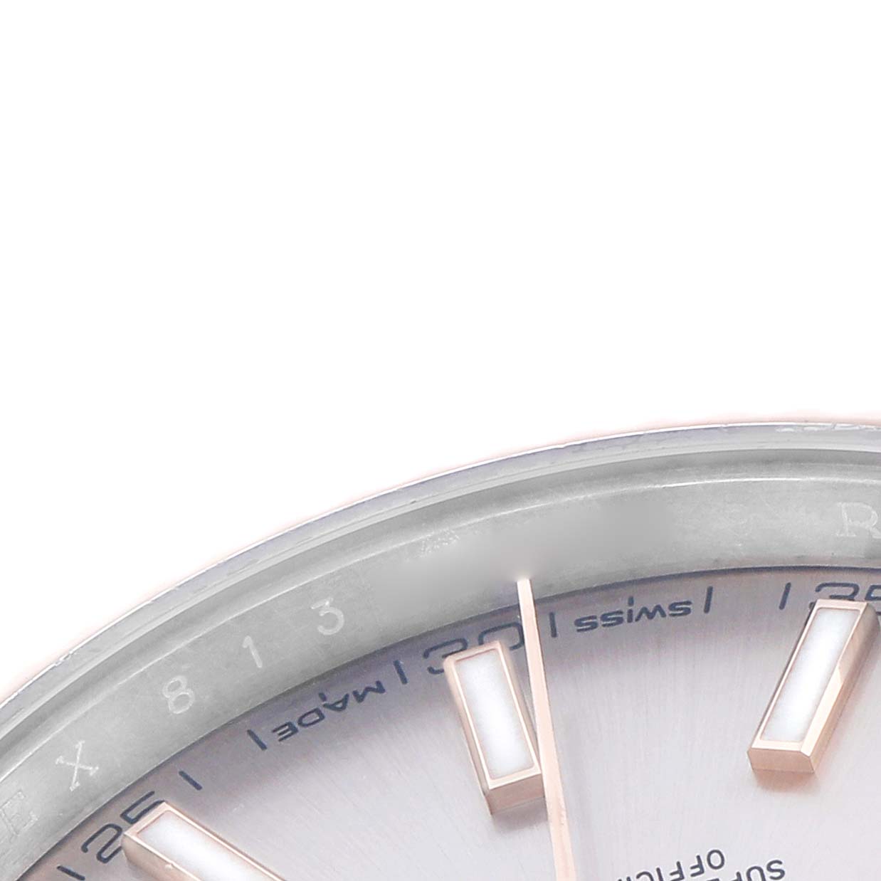 This image shows a close-up of the Rolex Datejust 41 126331 Men
s Steel and Gold (two tone) Pink Dial
s dial, focusing on the indices and part of the bezel.