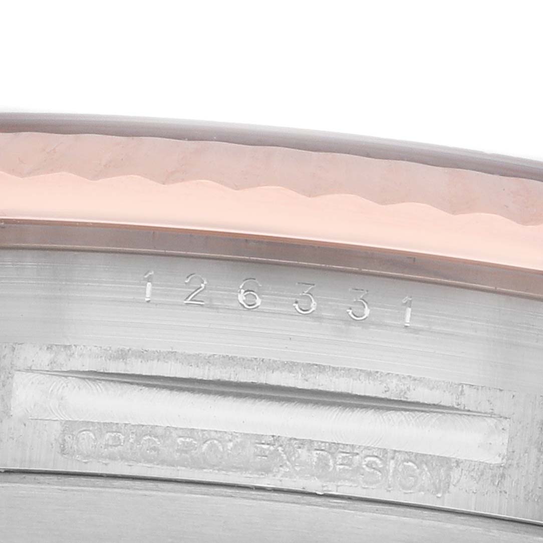 The image shows a close-up of the case edge and reference number on a Rolex Datejust 41 126331 Men
s Steel and Gold (two tone) Pink Dial.
