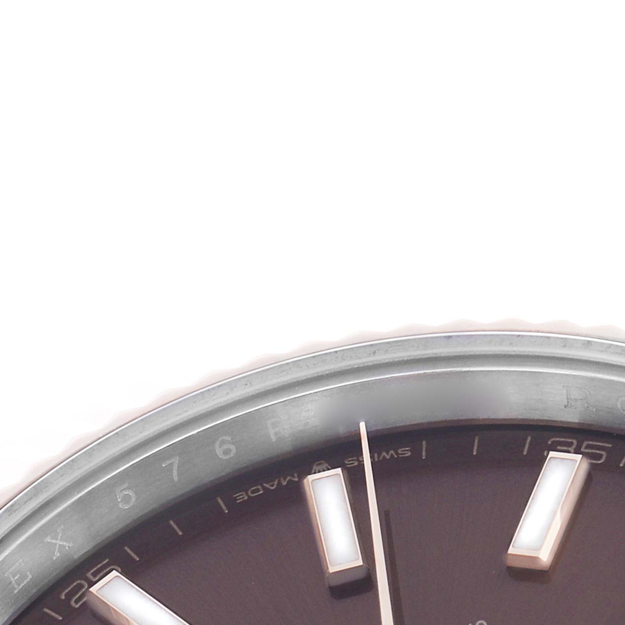 The image shows a close-up of the Rolex Datejust 41 126331 Men
s Steel and Gold (two tone) Brown Dial dial, focusing on the hour markers and part of the bezel.