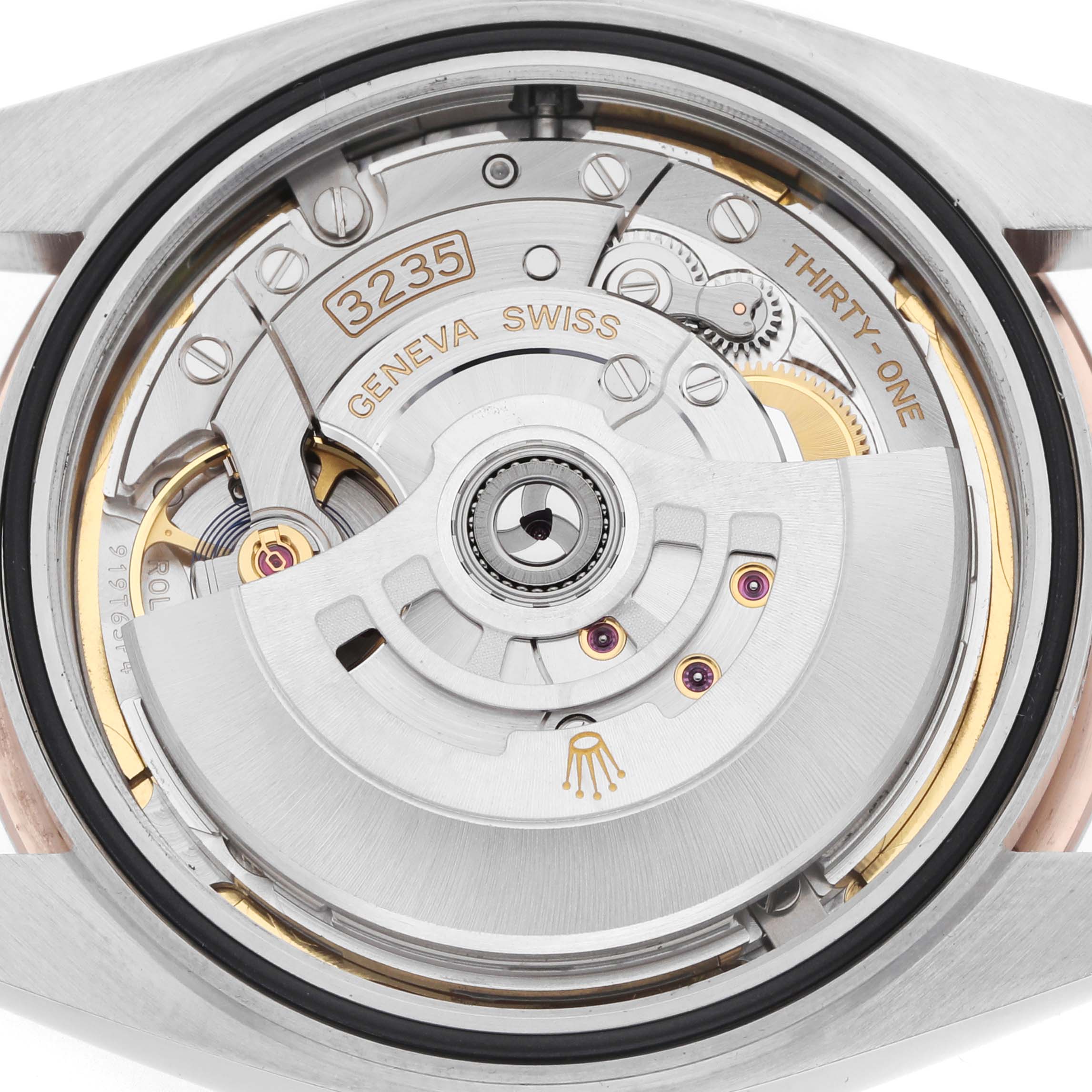 The image shows the movement and rotor of a Rolex Datejust 41 126331 Men
s Steel and Gold (two tone) Brown Dial, captured from the back.