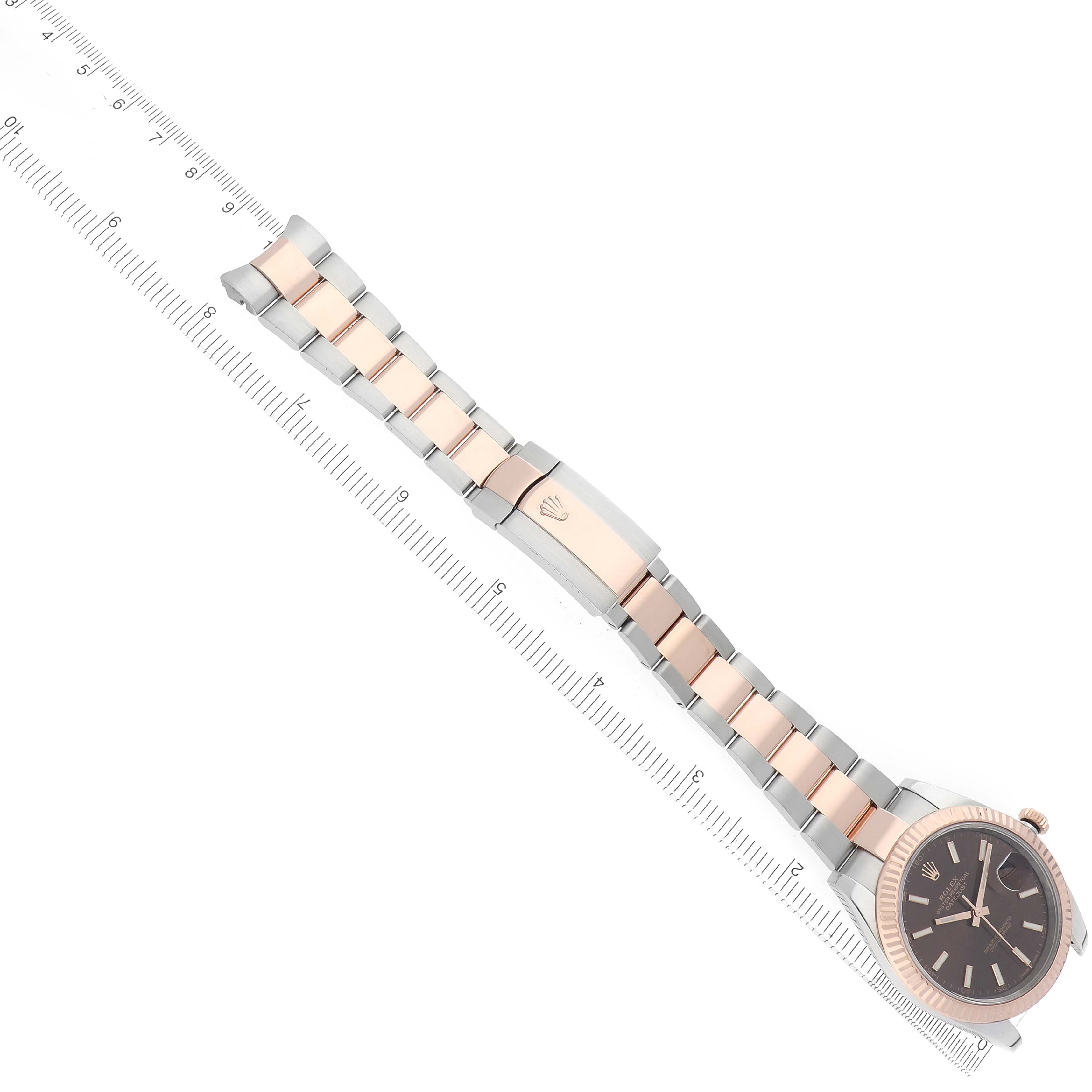 The Rolex Datejust 41 126331 Men
s Steel and Gold (two tone) Brown Dial watch is shown from a top-down angle, highlighting its bracelet, clasp, and face.