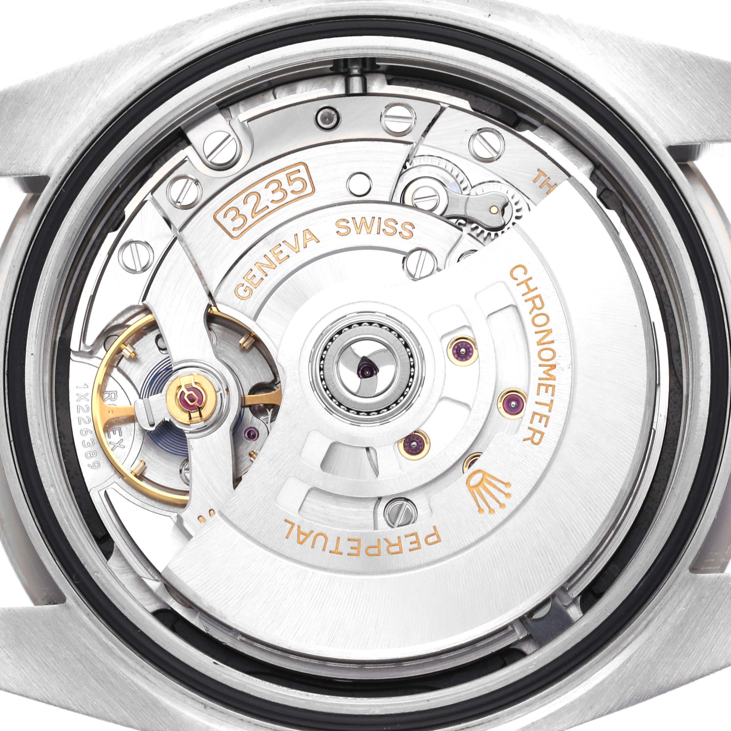 The image shows a close-up of the Rolex Datejust 41 126334 Men
s Stainless Steel Black Dial 126334 Men
s Stainless Steel Black Dial movement, highlighting the Geneva Swiss inscription and the 3235 model number.