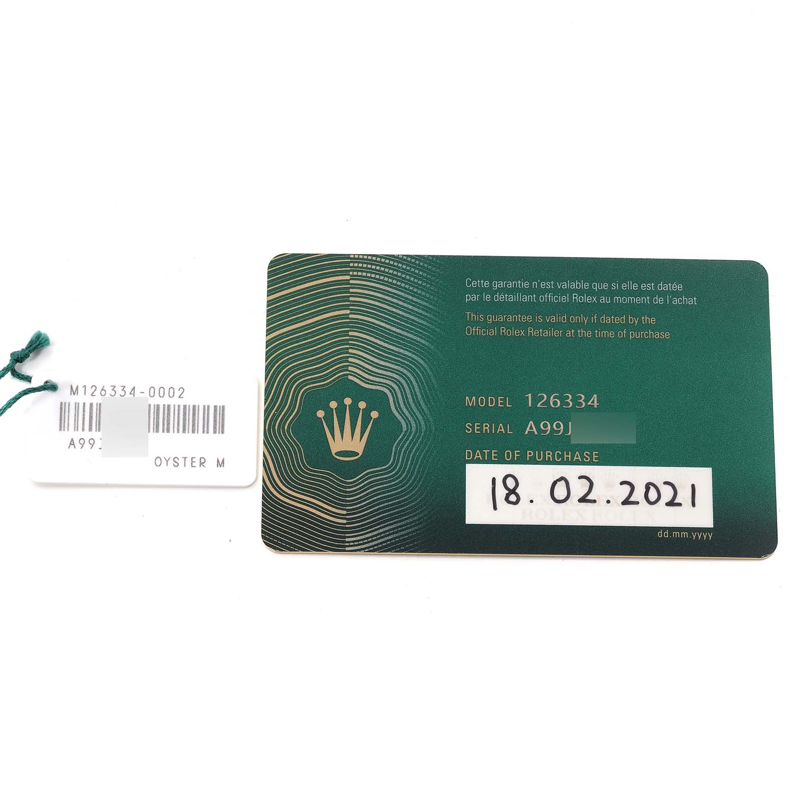The image shows the warranty card and a tag for the Rolex Datejust 41 126334 Men
s Stainless Steel Blue Dial 126334 Men
s Stainless Steel Blue Dial model.
