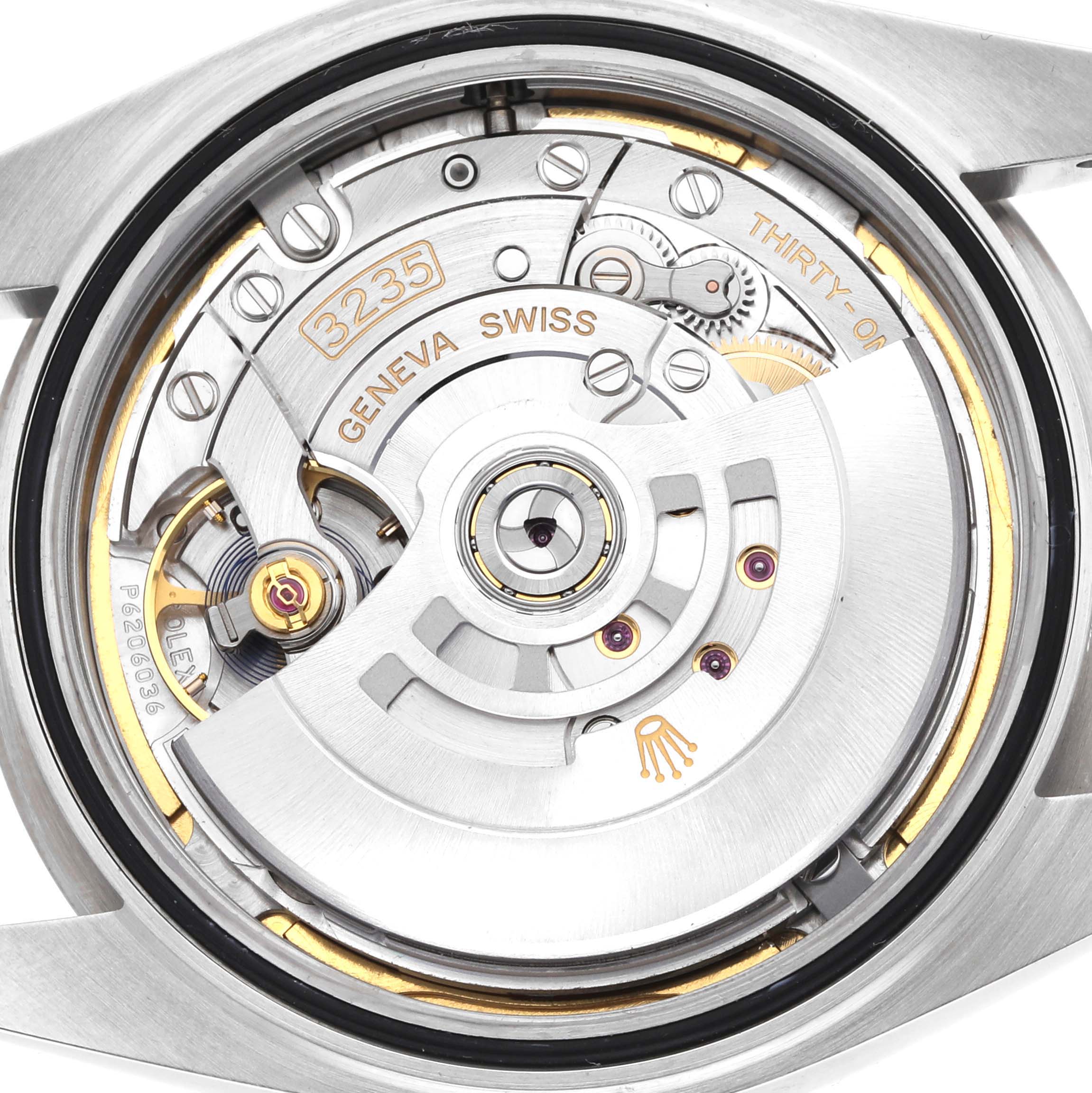 The image shows the movement mechanism of the Rolex Datejust 41 126334 Men's Stainless Steel Blue Dial from a back view, highlighting its intricate components.