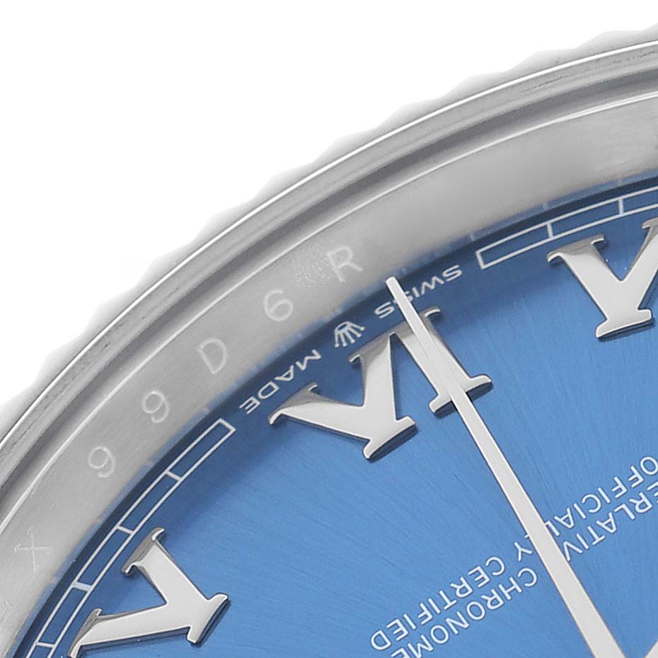 The image shows a close-up of the Rolex Datejust 41 126334 Men's Stainless Steel Blue Dial, highlighting the bezel, dial, and Roman numeral markers.