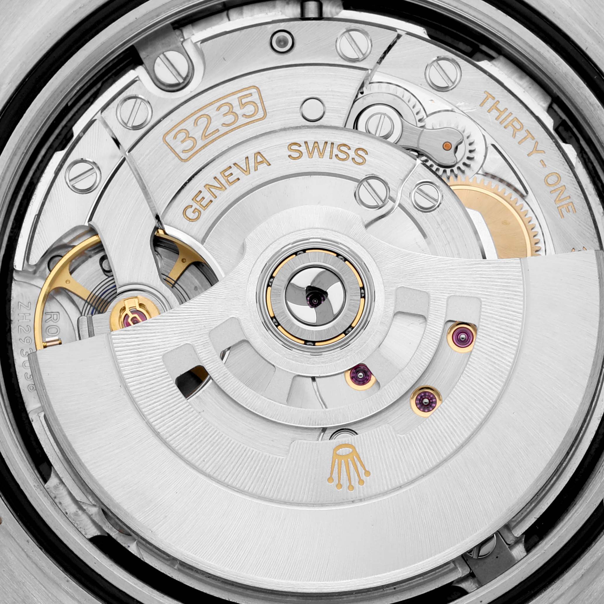 This image shows the movement and internal mechanics of a Rolex Datejust 41 126333 Men's Steel and Gold (two tone) Black Dial 126333 Men's Steel and Gold (two tone) Black Dial watch, highlighting the 3235 Swiss Geneva mechanism.