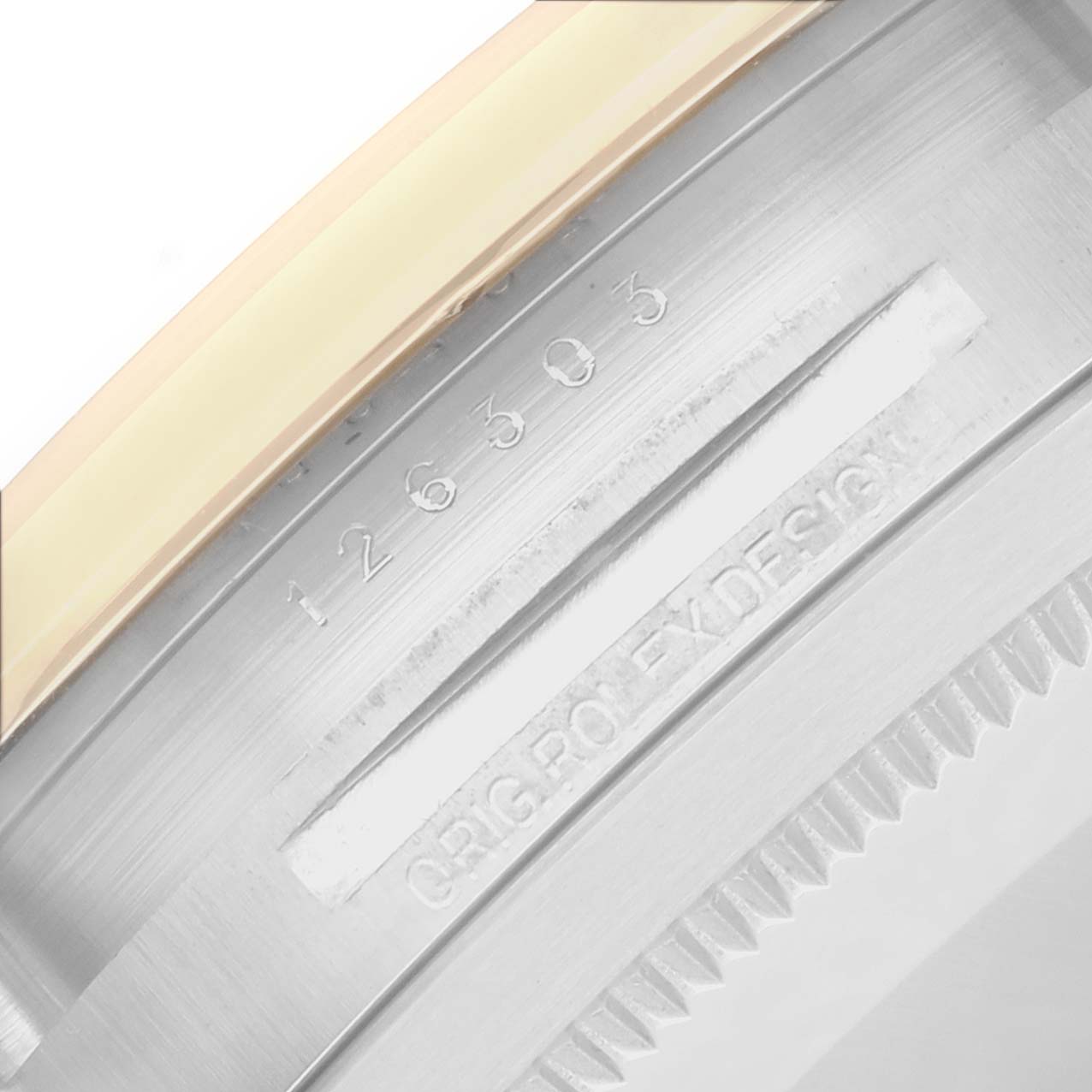 The image shows a close-up of the case edge of the Rolex Datejust 41 126303 Men
s Steel and Gold (two tone) Champagne Dial, highlighting the model number engraving and fluted bezel.